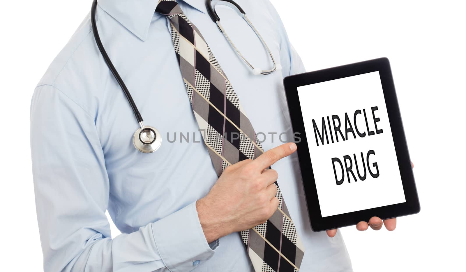 Doctor holding tablet - Miracle drug by michaklootwijk