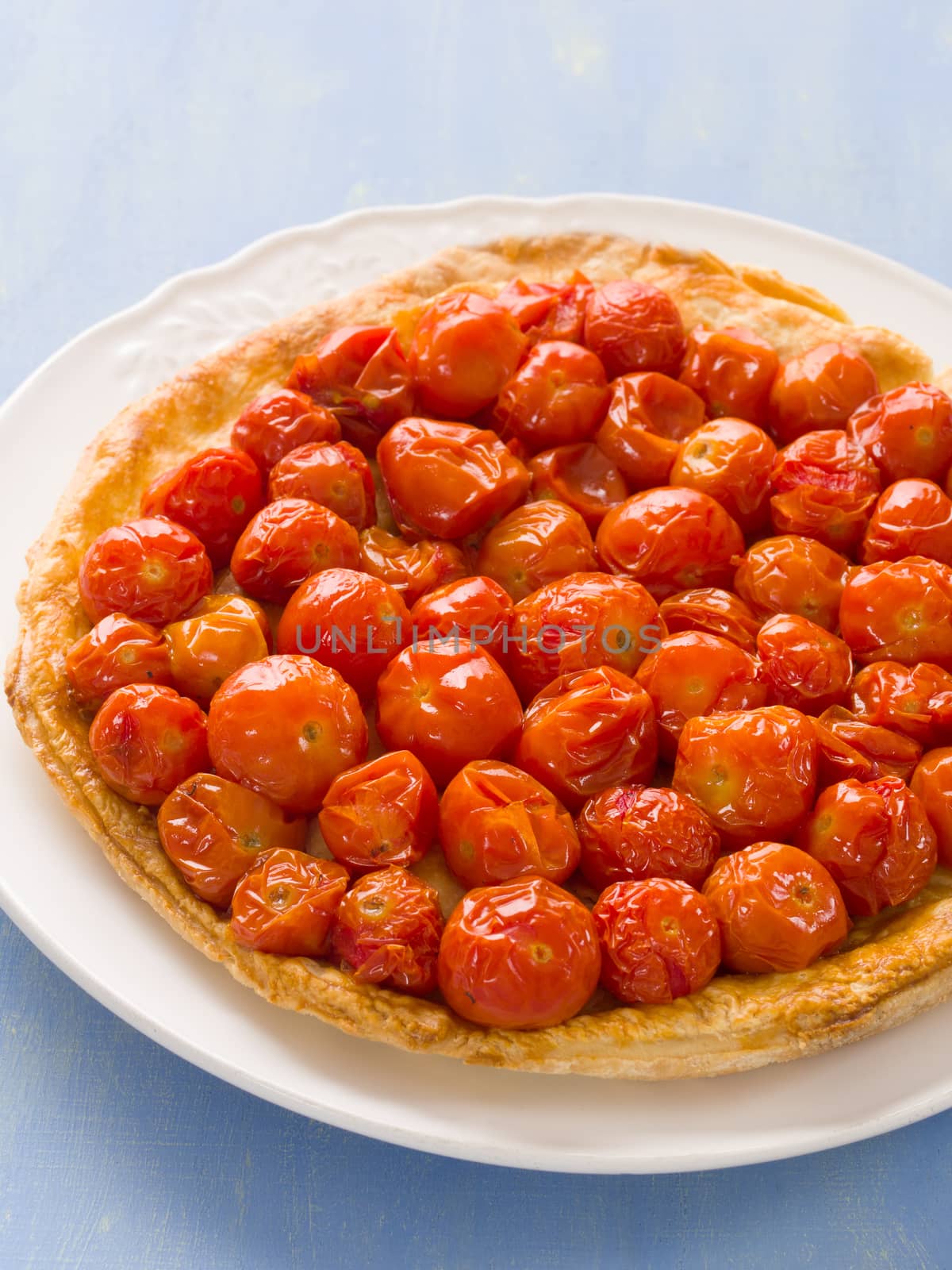 close up of rustic cherry tomato tarte tatin