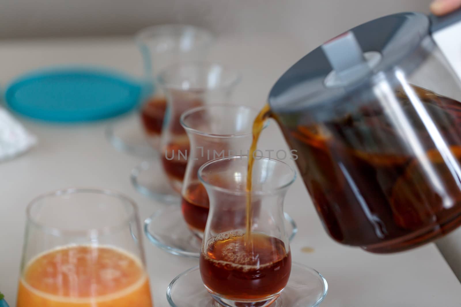 Close up detailed view of hot black tea in a glass.