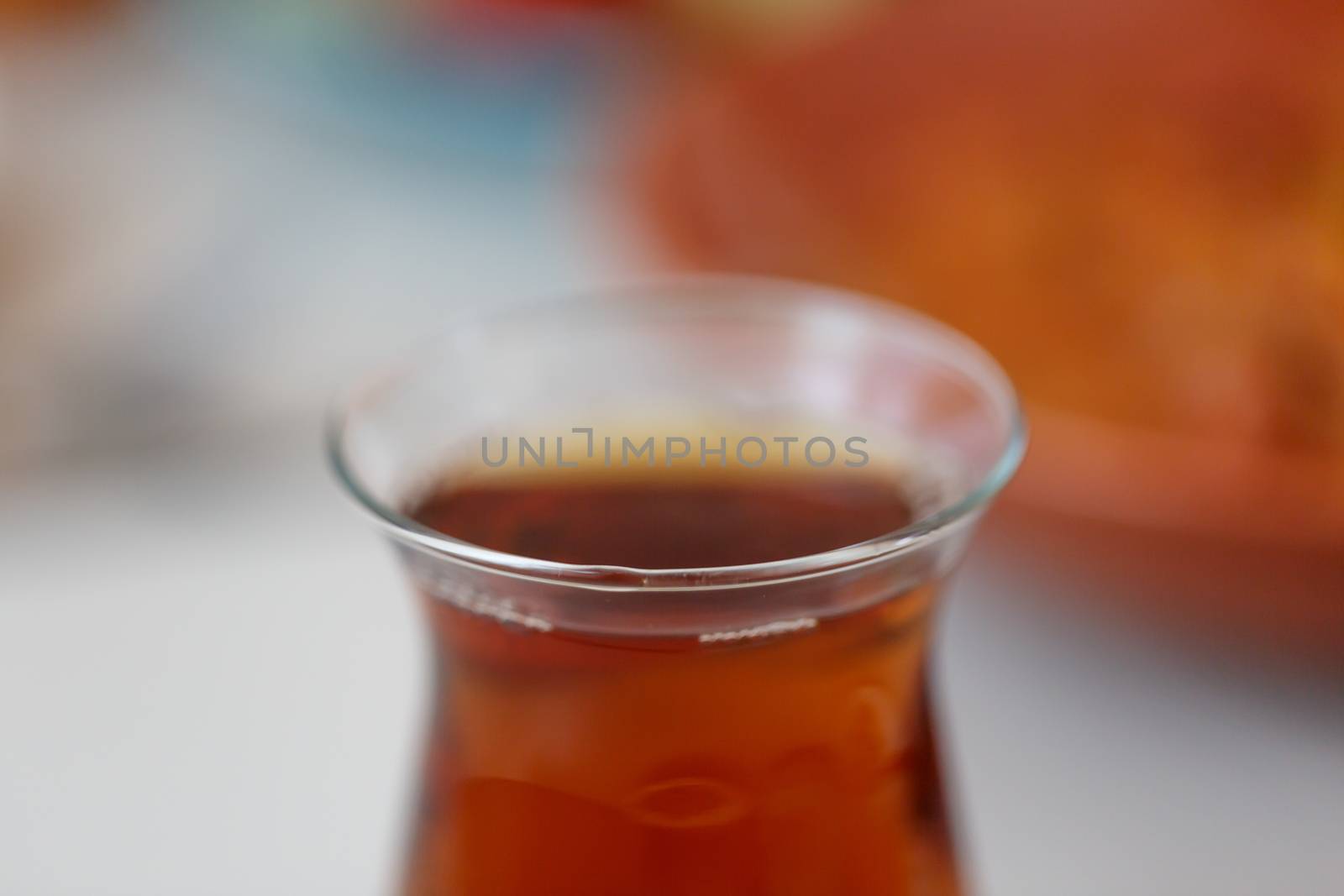 Close up detailed view of hot black tea in a glass.