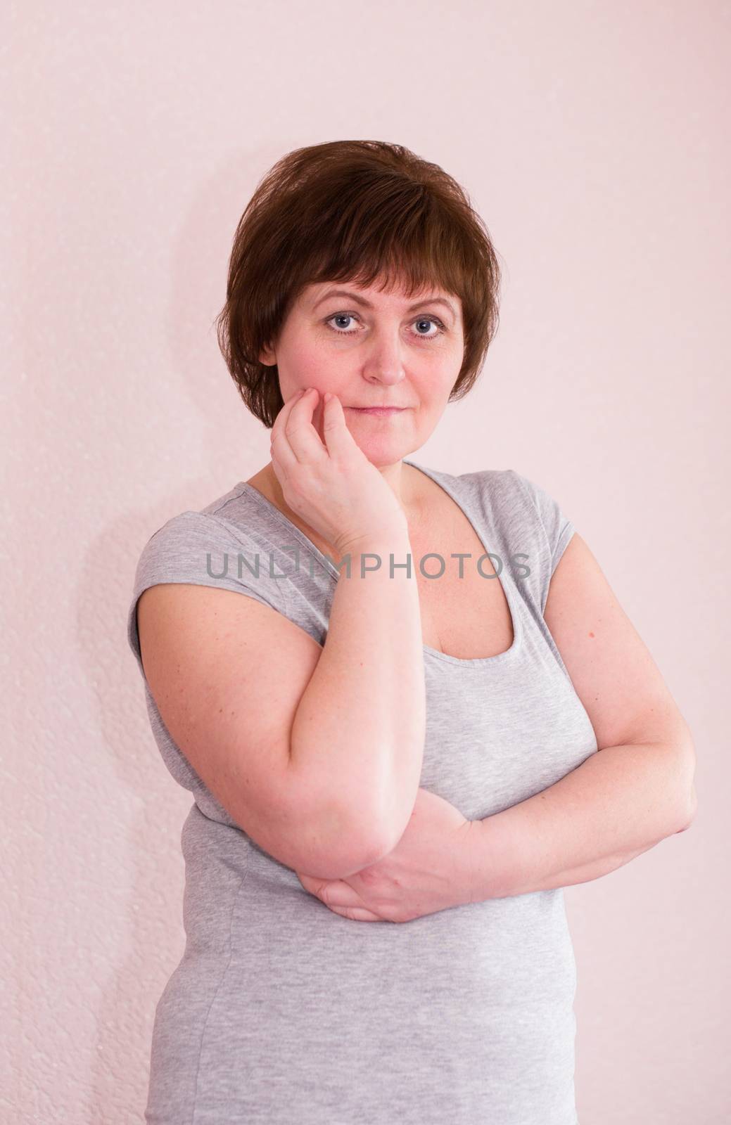 Portrait Of Attractive Mature Woman, her hand on chin