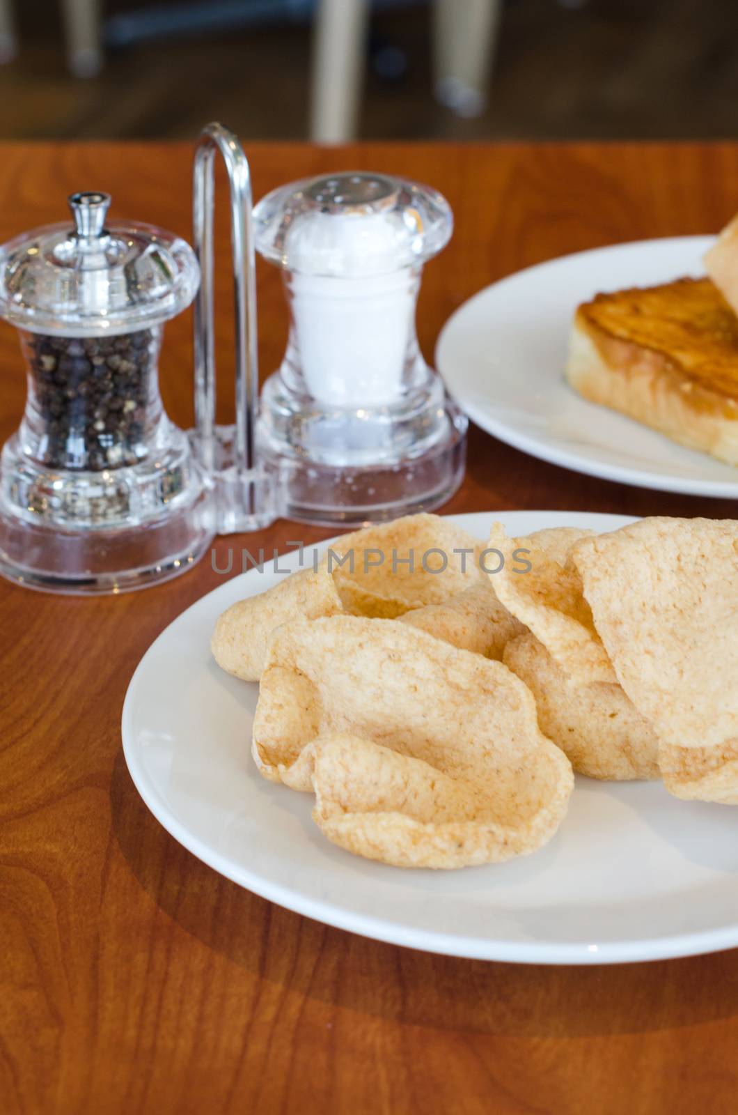 Crisp rice with seasoning on wood table