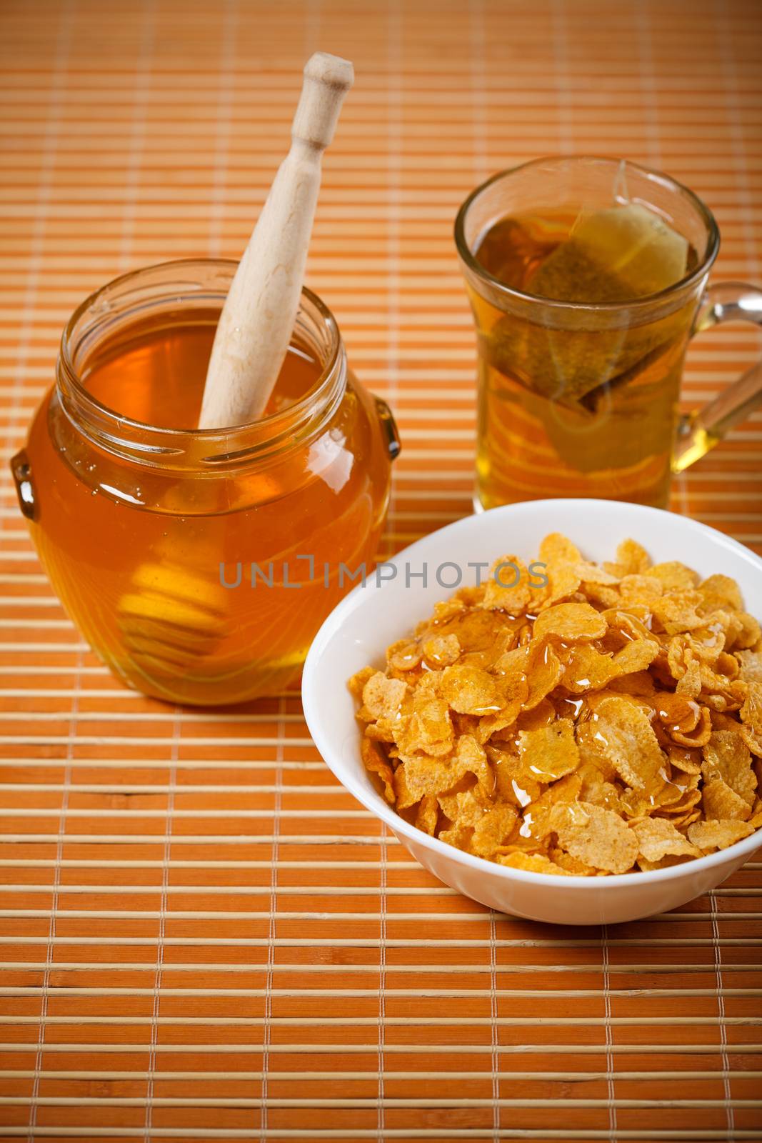 fresh honey, tea and breakfast flakes by MilanMarkovic78