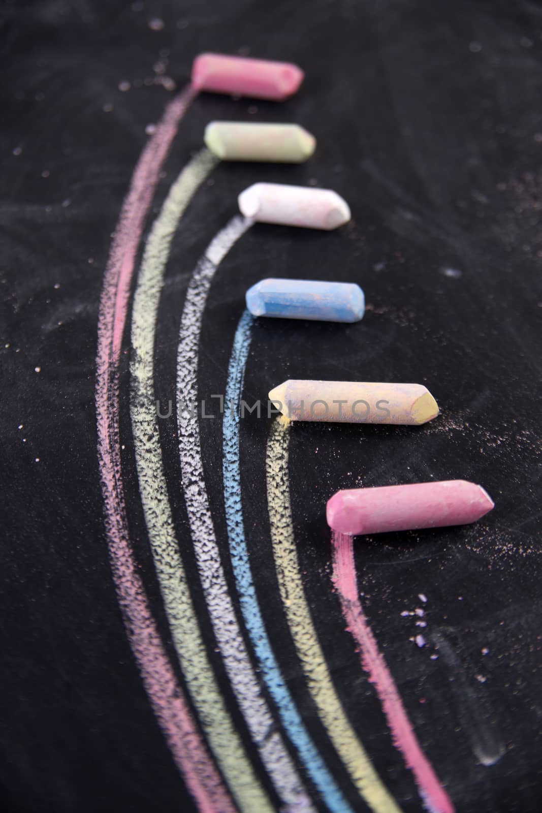 Graphical display with colored chalk to represent the rainbow