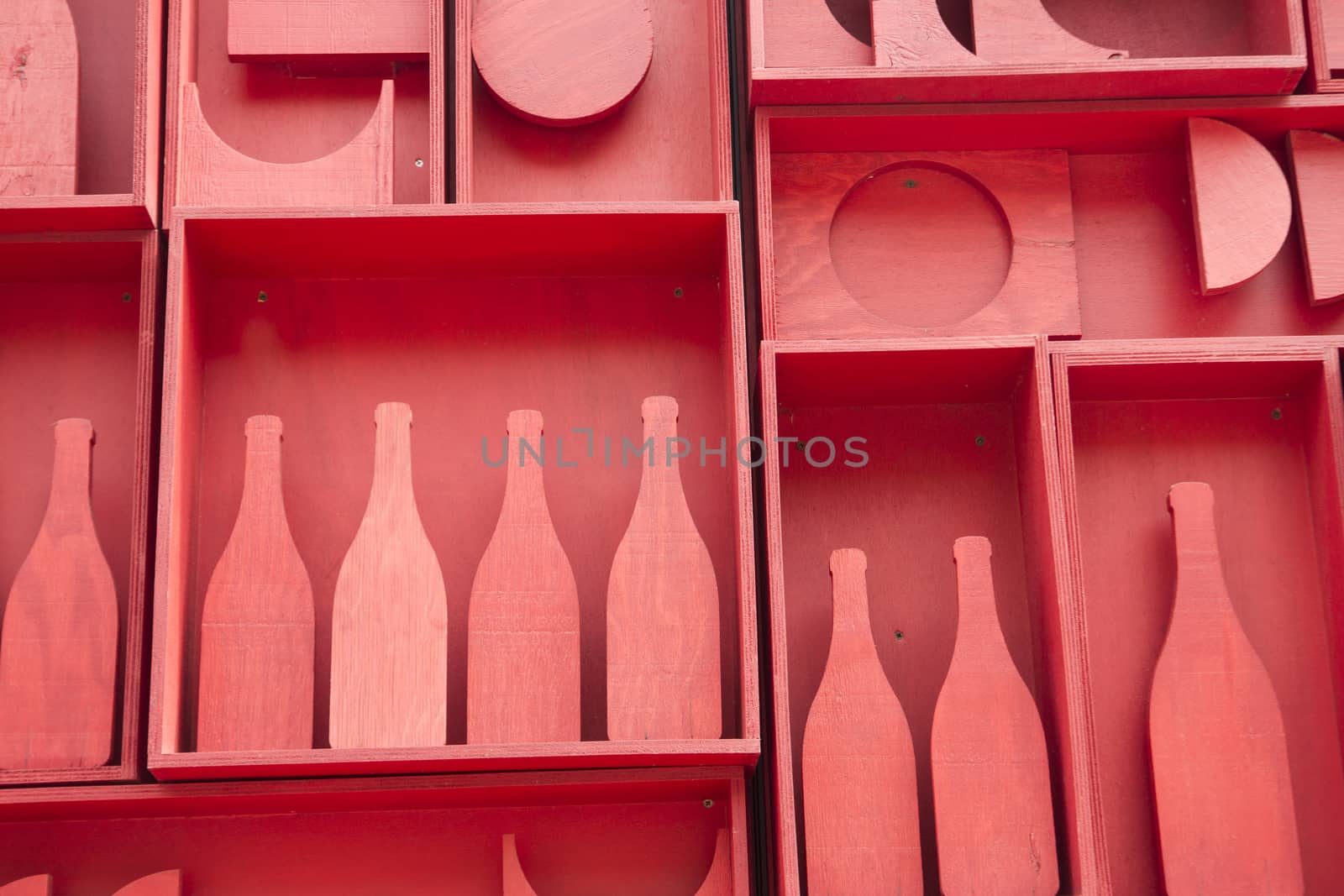 Stylized representation of a small cellar of wine bottles