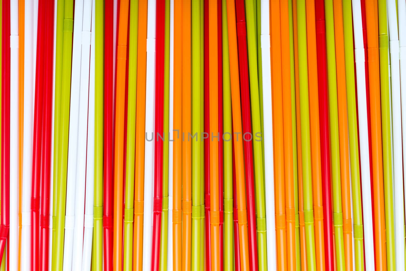 The colorful plastic tubes background and texture