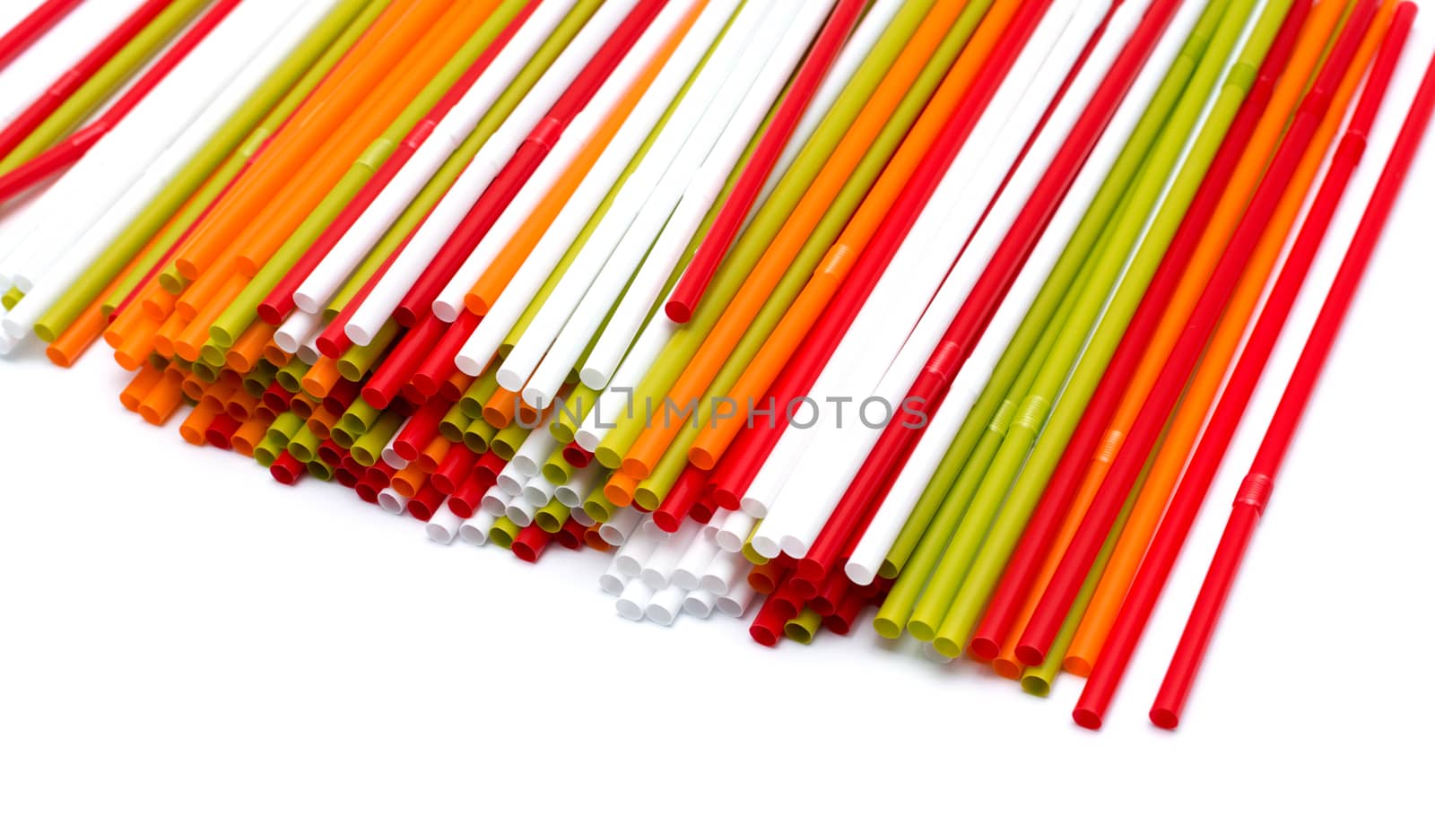 Colorful straws on white background