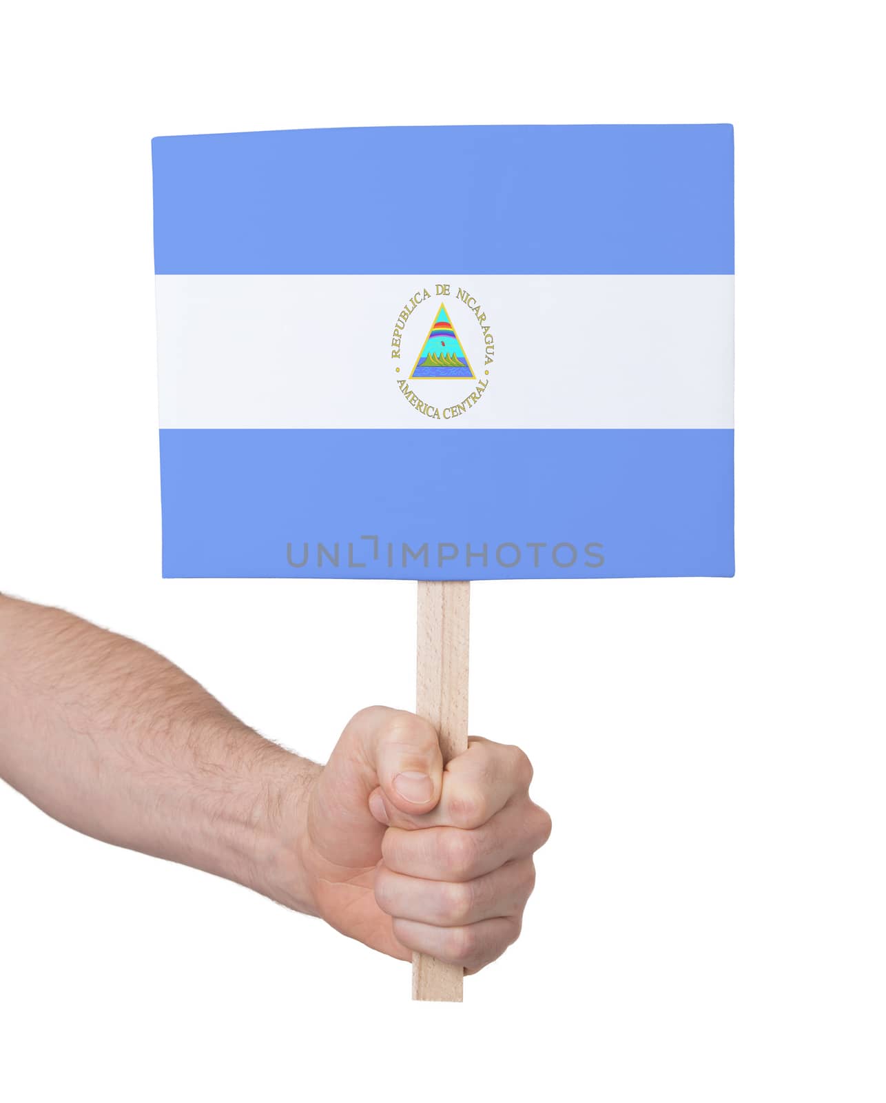 Hand holding small card - Flag of Nicaragua by michaklootwijk
