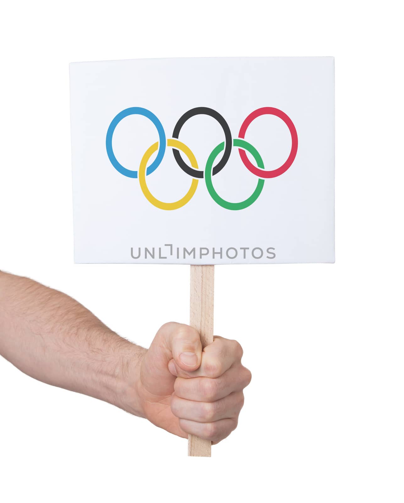 Hand holding small card, isolated on white - Flag of the Olympic games