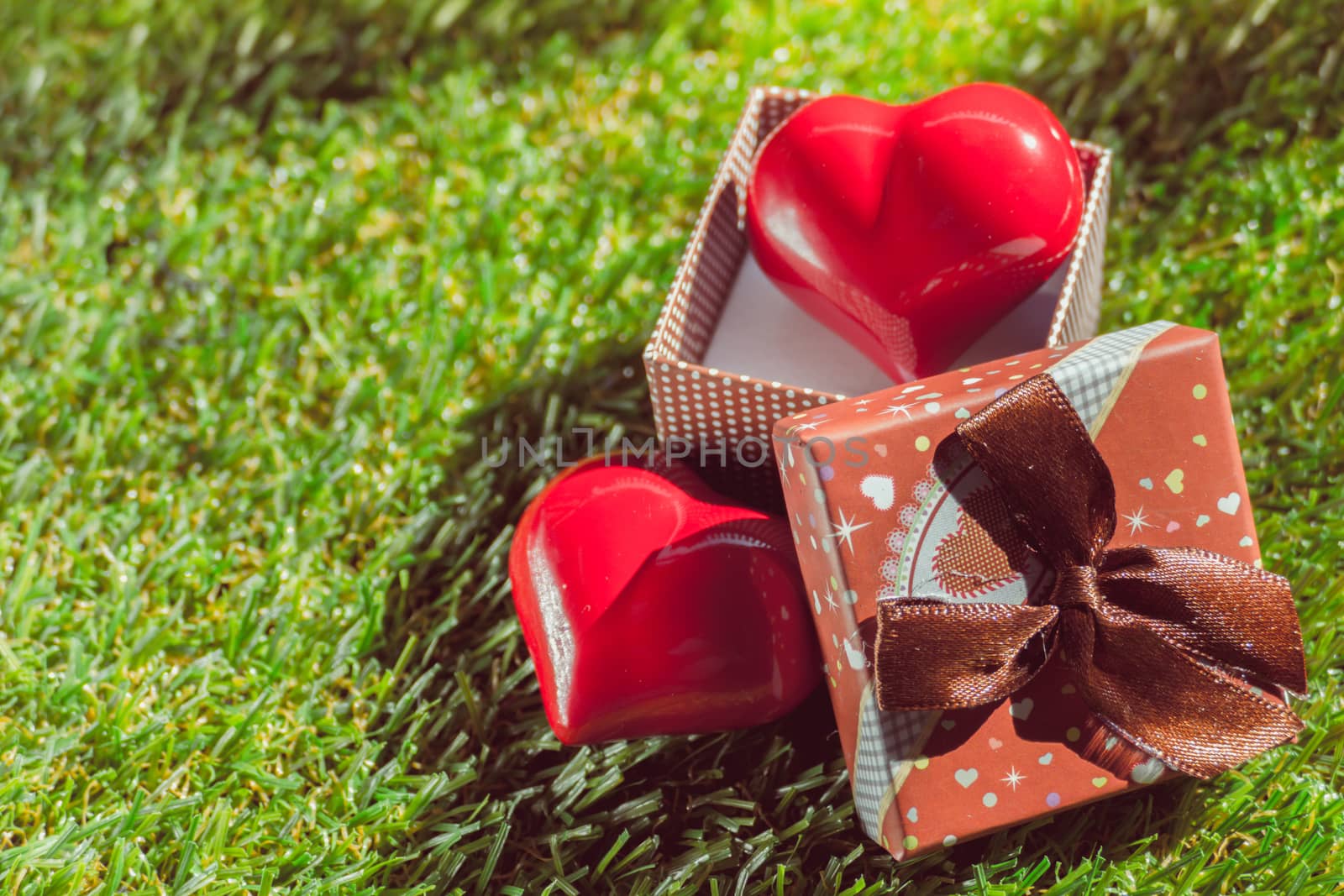 Gift of love. hearty gift. A gift box with a red heart inside. art background