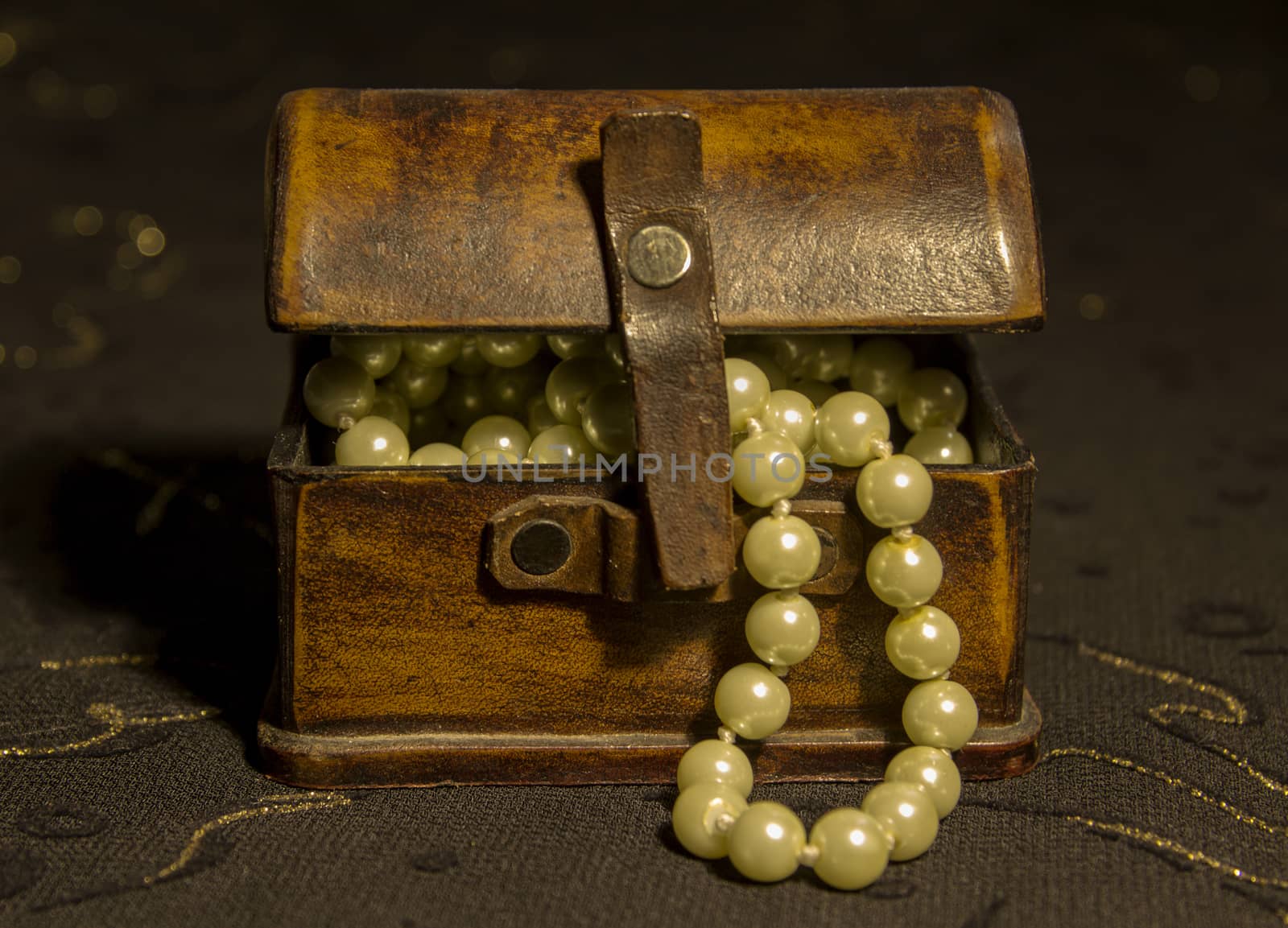 Pearl Necklace in an ancient casket on a dark background