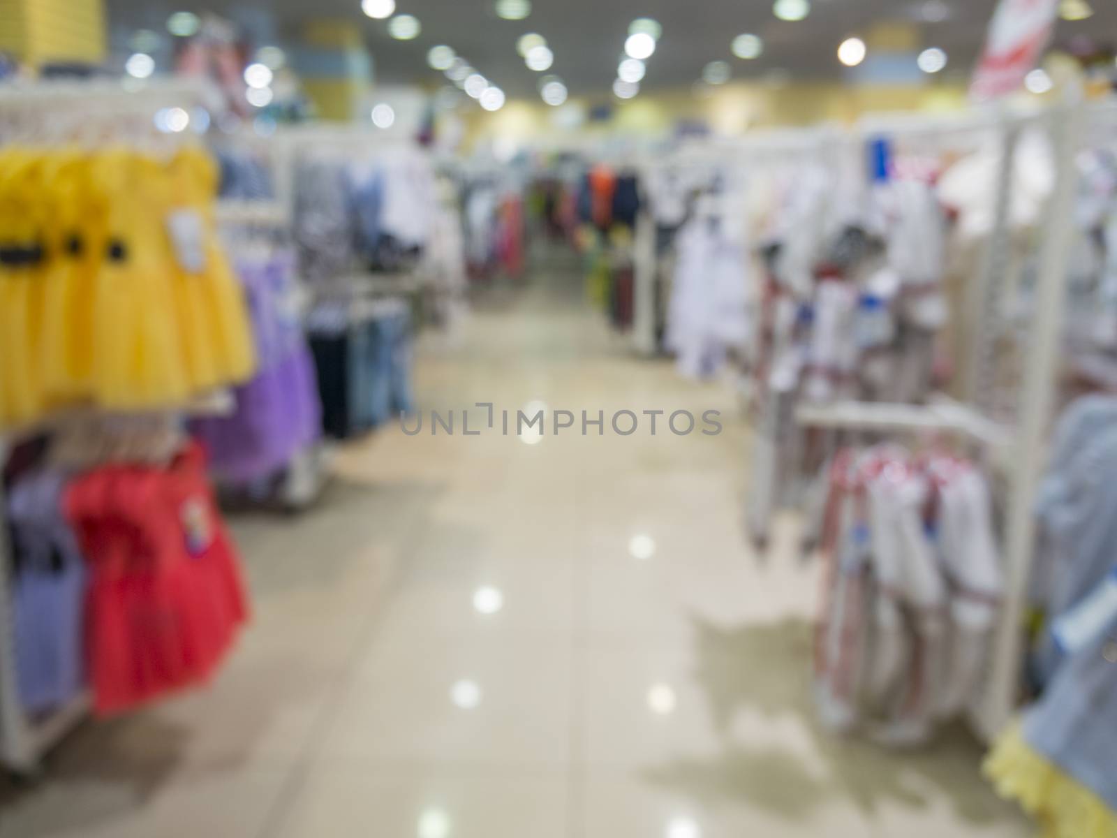 Blurred kids wear of departament store by fascinadora
