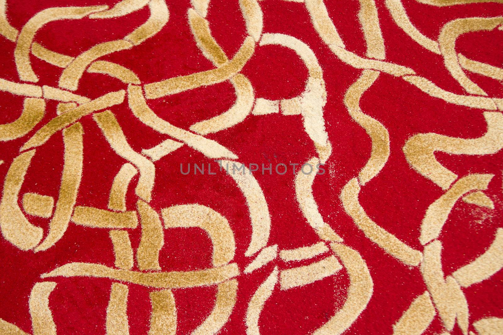 Small details of colored carpets performed with the use of wood sawdust