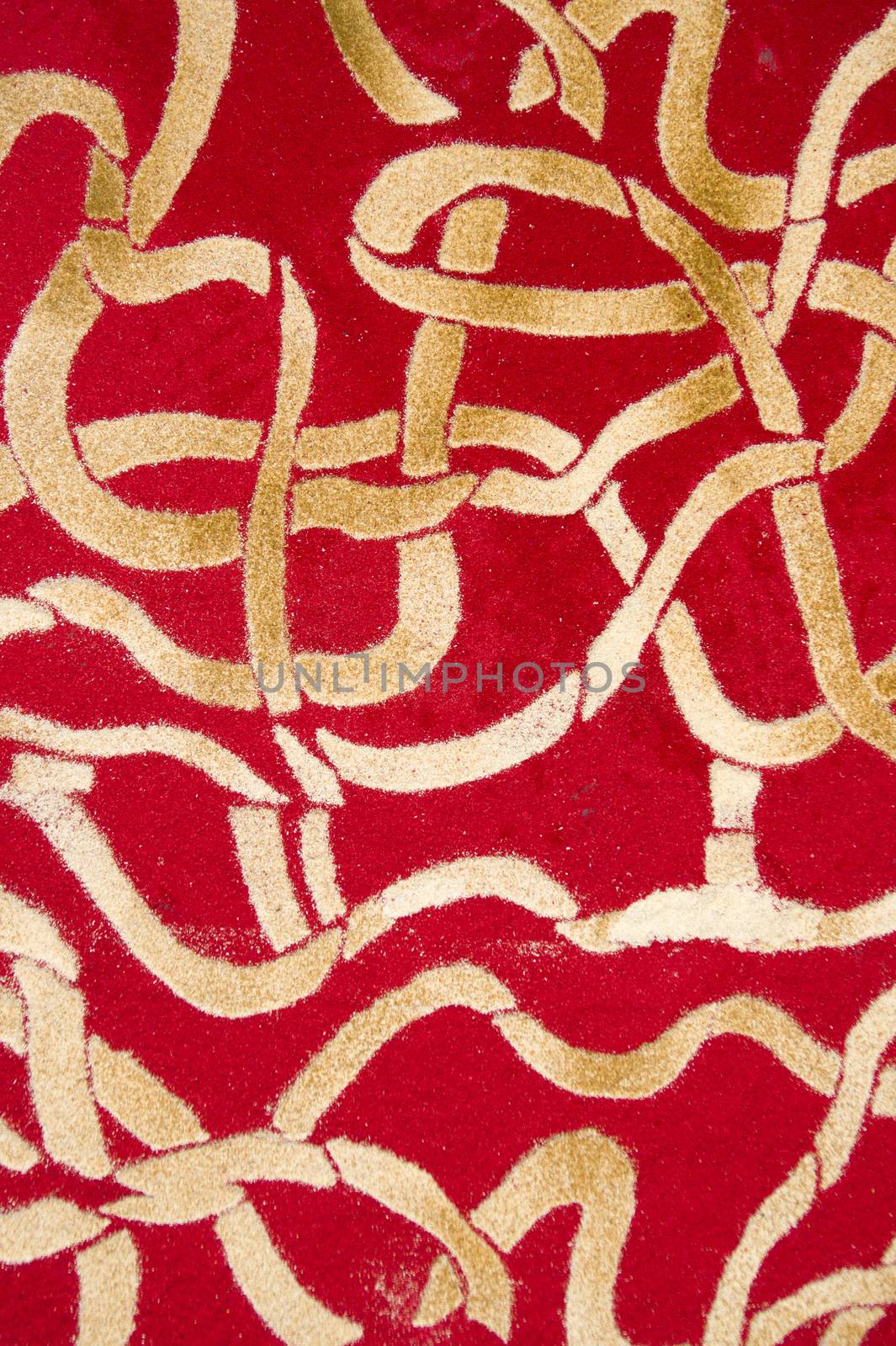 Small details of colored carpets performed with the use of wood sawdust