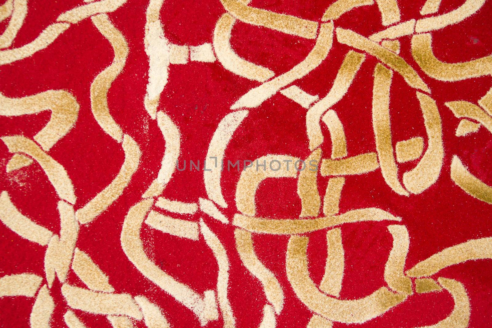 Small details of colored carpets performed with the use of wood sawdust