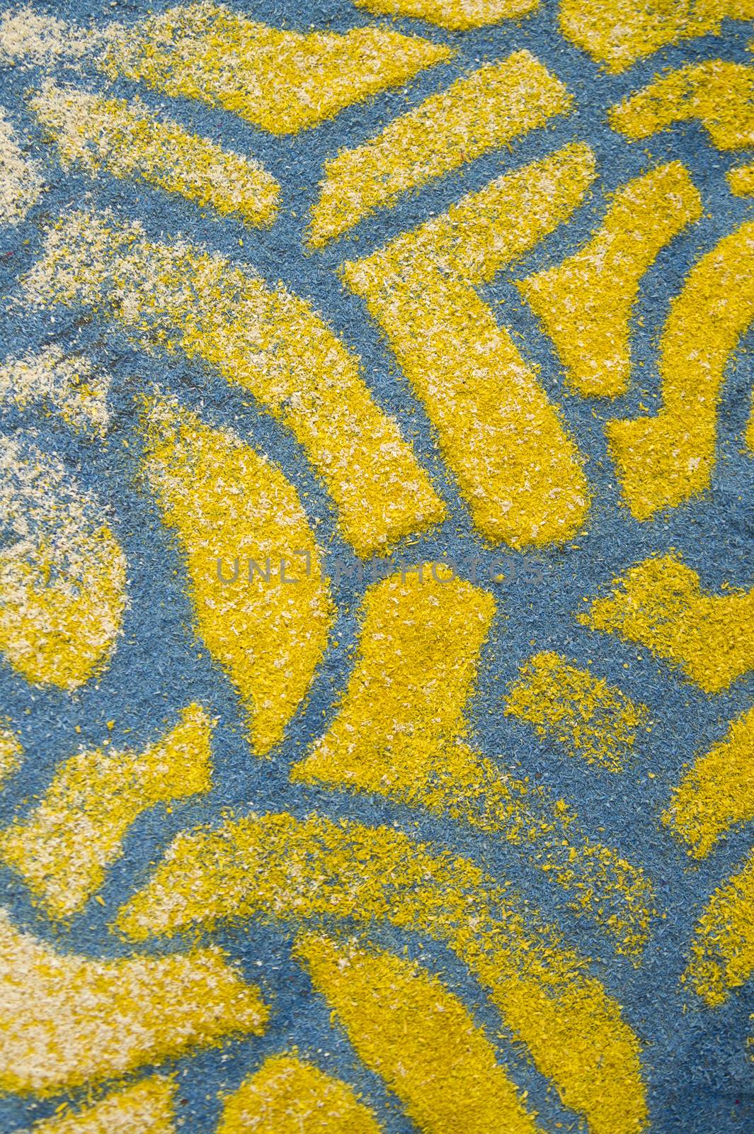 Small details of colored carpets performed with the use of wood sawdust