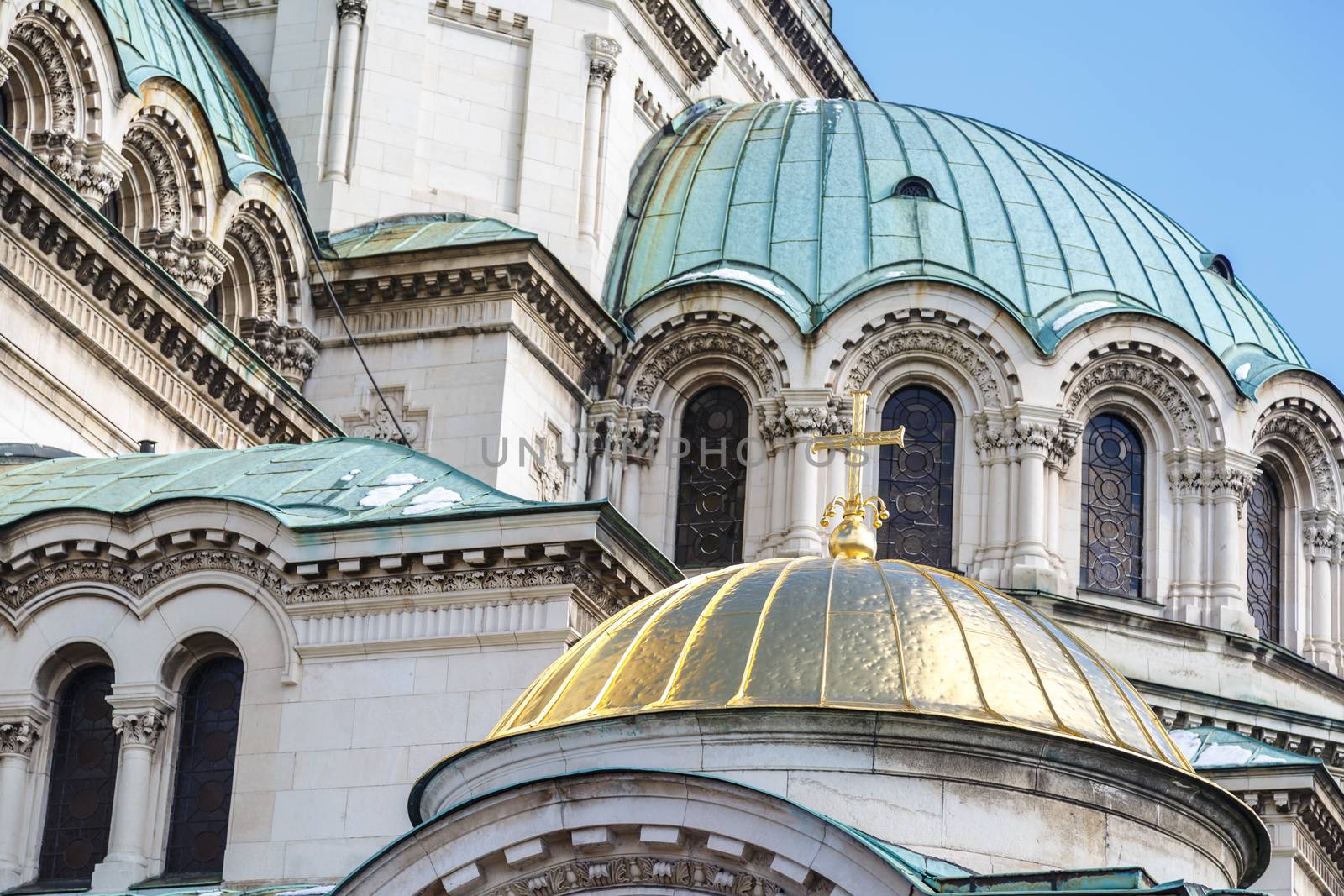 Close up detailed view of famous Bulgarian Orthodox church of Alexander Nevsky Cathedral built in 1882 in Sofia, Bulgaria, on blue sky background.