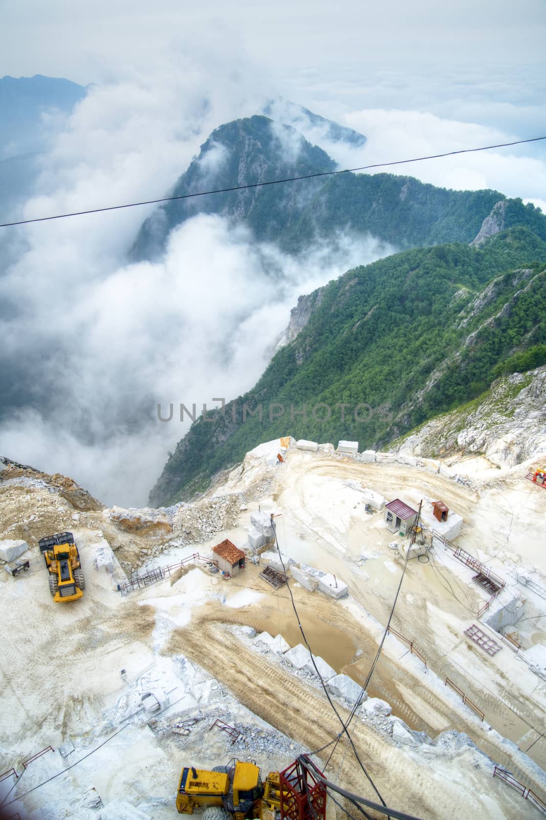 Broad view of the process in the white marble quarries in Carrara Italy