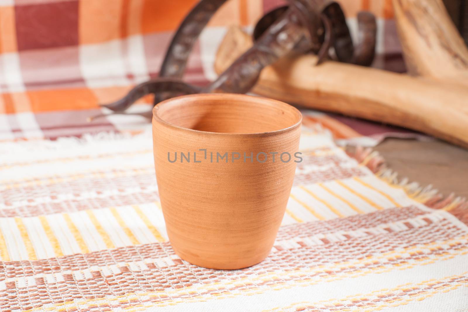Traditional handcrafted mug on multycolor background. High resolution