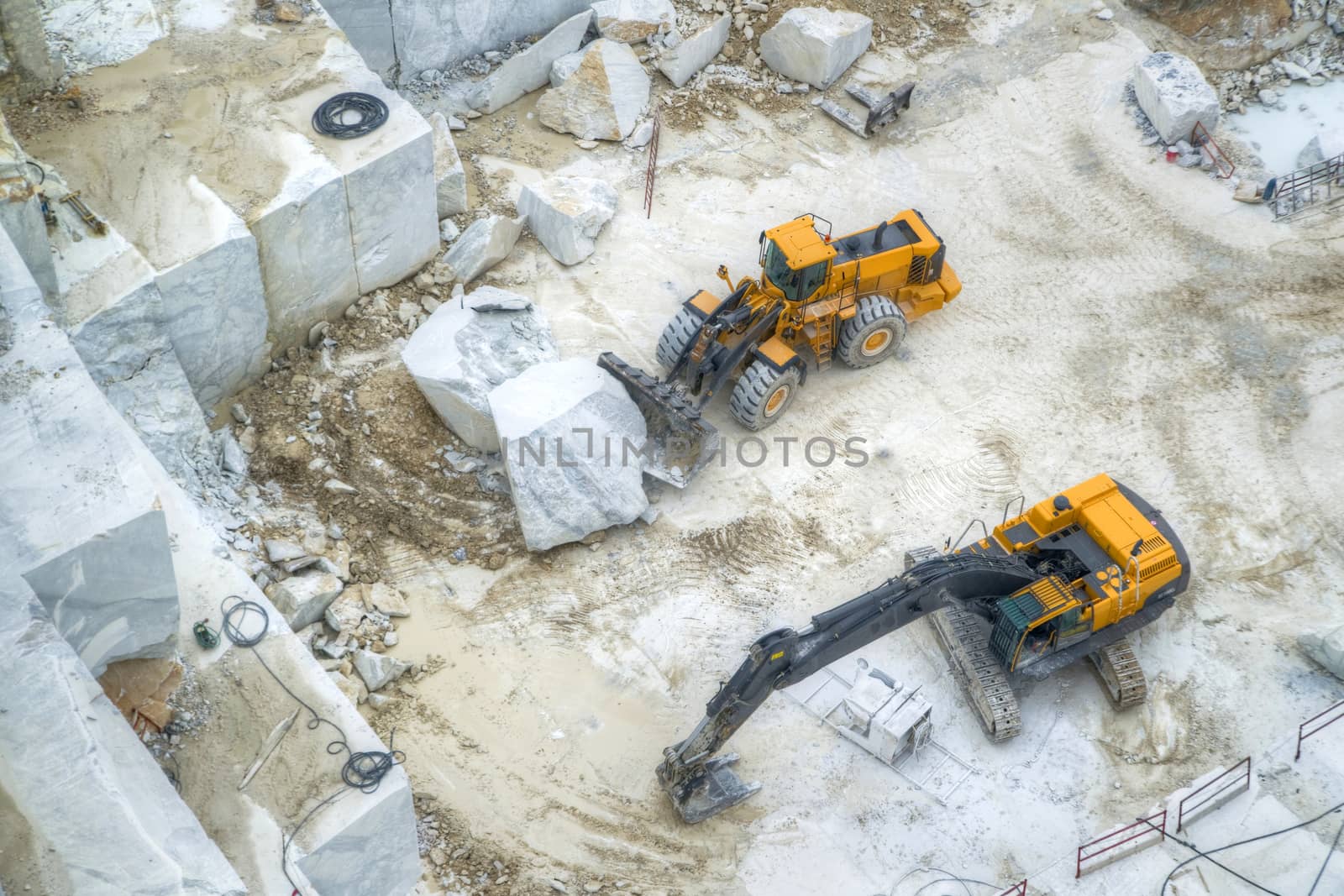 Broad view of the process in the white marble quarries in Carrara Italy