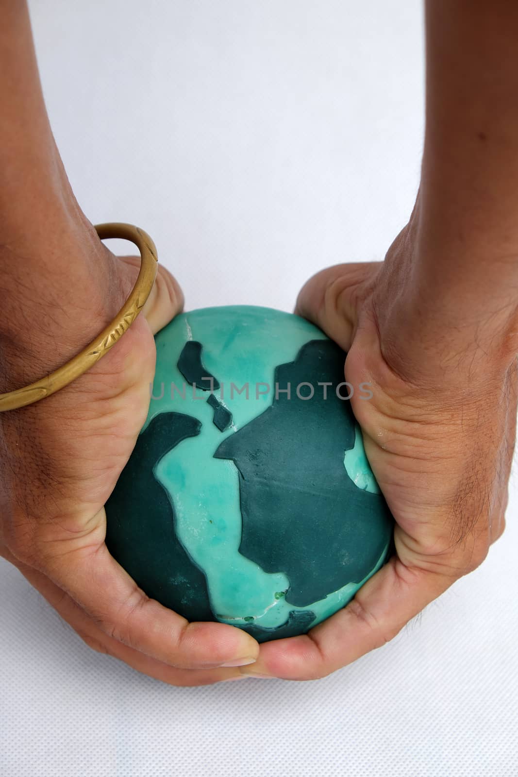 Concept for destroy the earth by human hand on white background, human ruin green planet, is worldwide problem, can make climate change, disaster, damaged environment