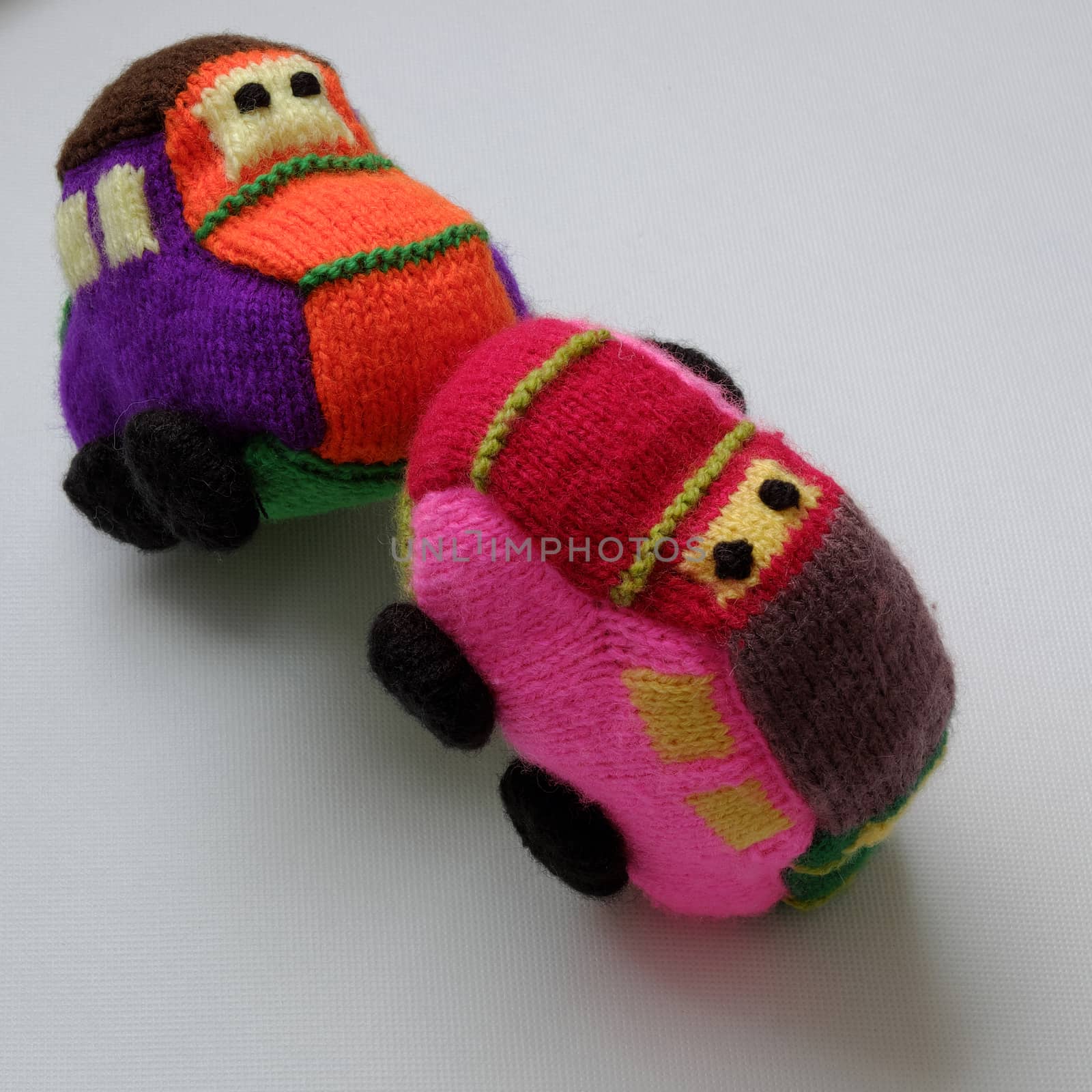 Handmade gift for children, two colorful baby car knit from yarn, funny emotion on couple car, homemade toy as amazing present