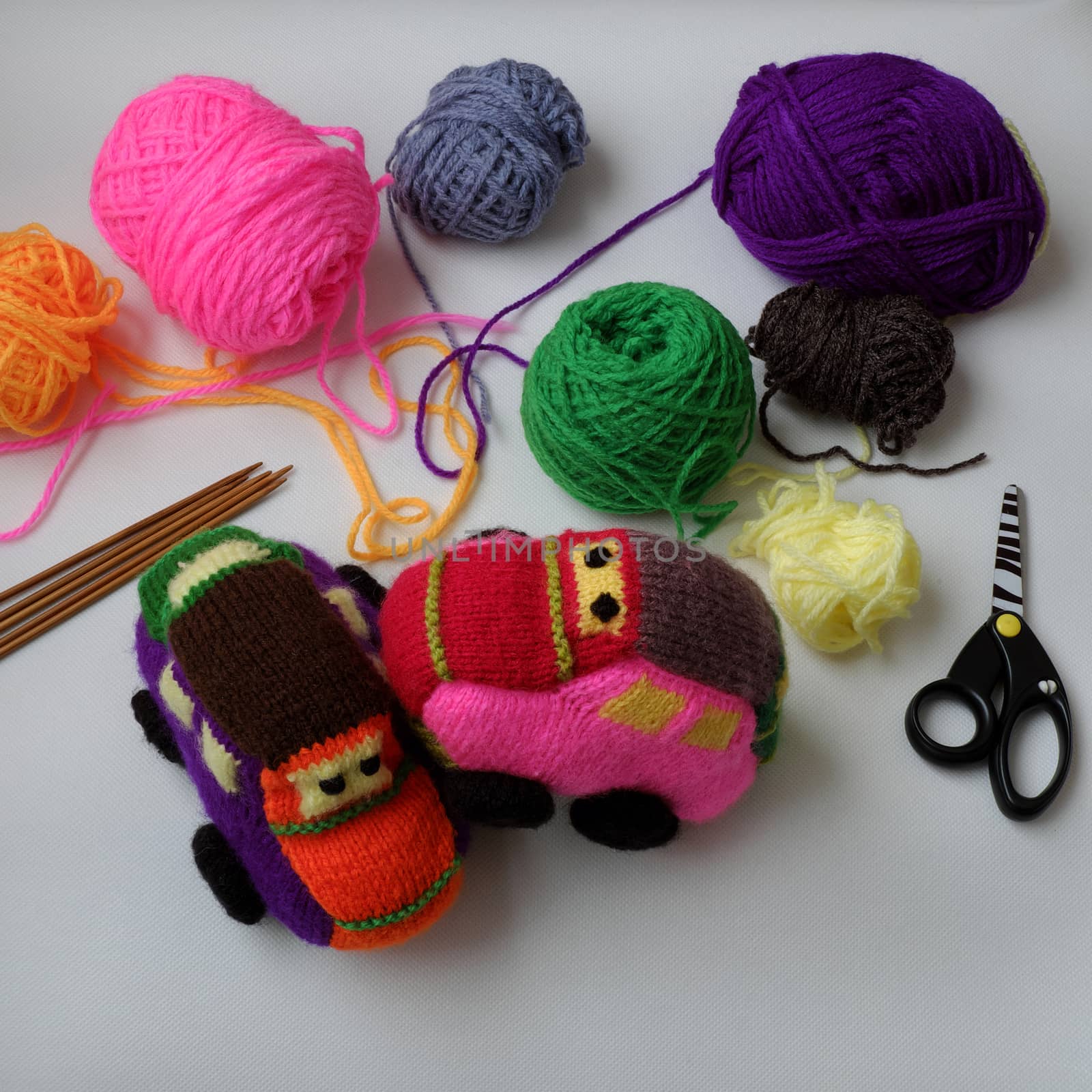 Handmade gift for children, two colorful baby car knit from yarn, funny emotion on couple car, homemade toy as amazing present