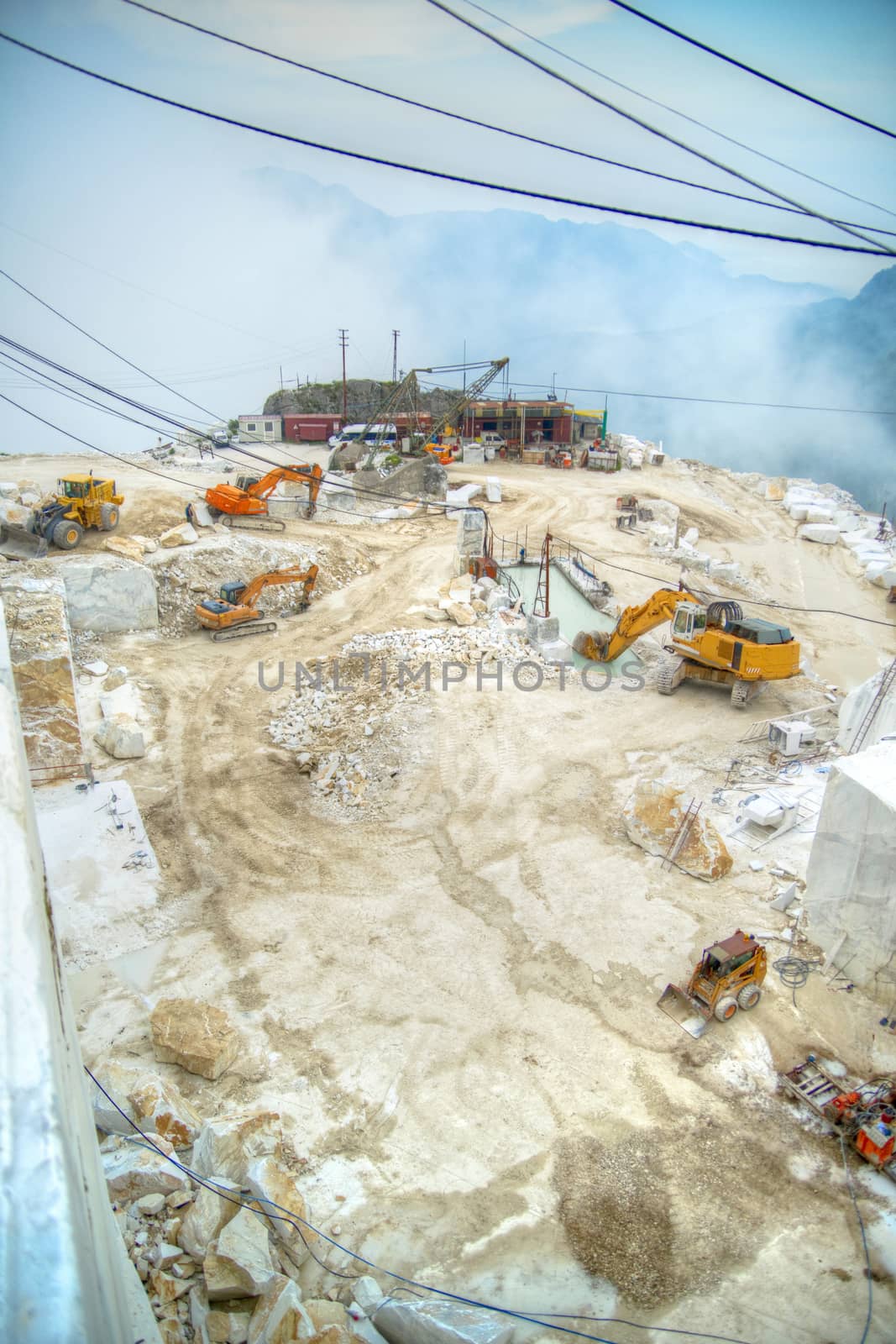 Broad view of the process in the white marble quarries in Carrara Italy