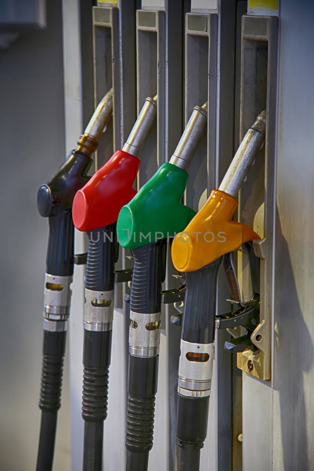 Fuel nozzle at a gas station by vladacanon