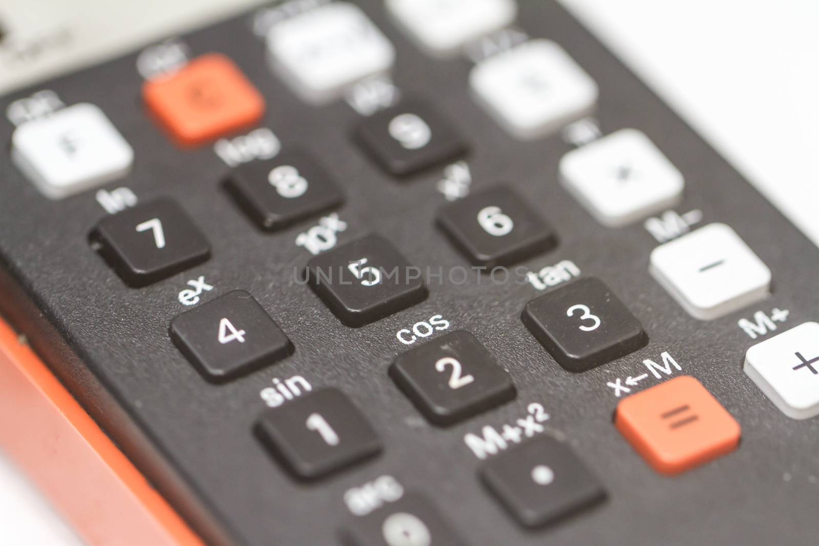 Close up detailed view of historical old calculator with small iron buttons.