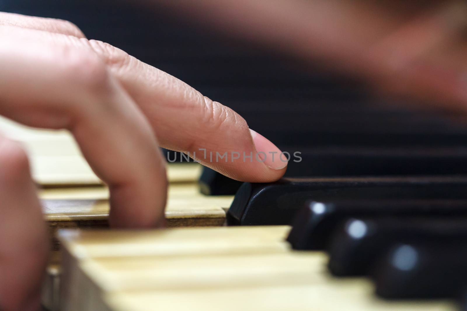 Close up detailed view of historical old piano with white and black buttons.