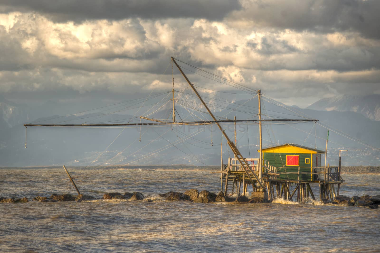 Traditional wooden buildings for fishing situated on the estuary of the River Arno Tuscany Italy.