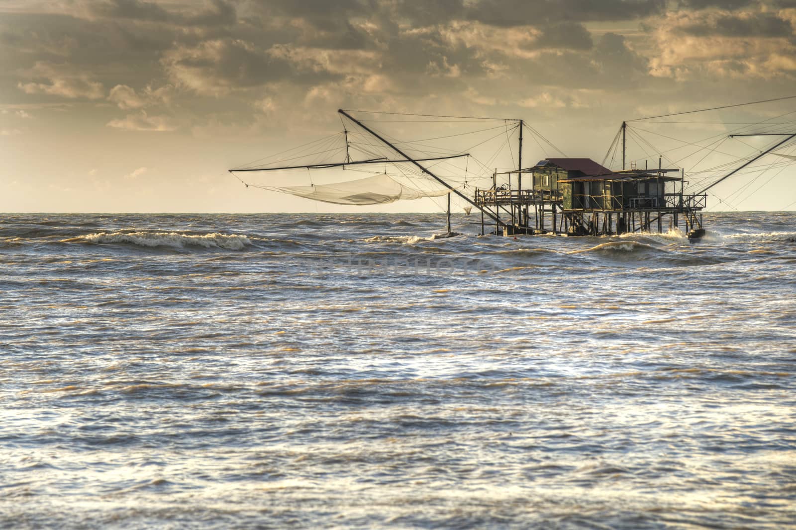 Traditional wooden buildings for fishing situated on the estuary of the River Arno Tuscany Italy.