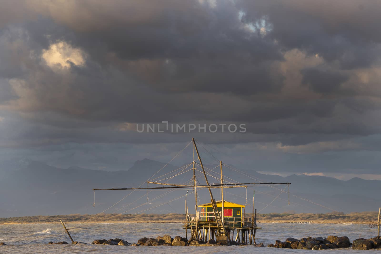 Traditional wooden buildings for fishing situated on the estuary of the River Arno Tuscany Italy.