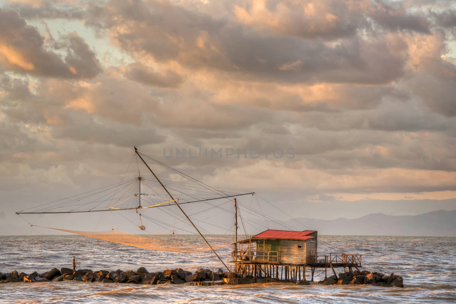 Traditional wooden buildings for fishing situated on the estuary of the River Arno Tuscany Italy.