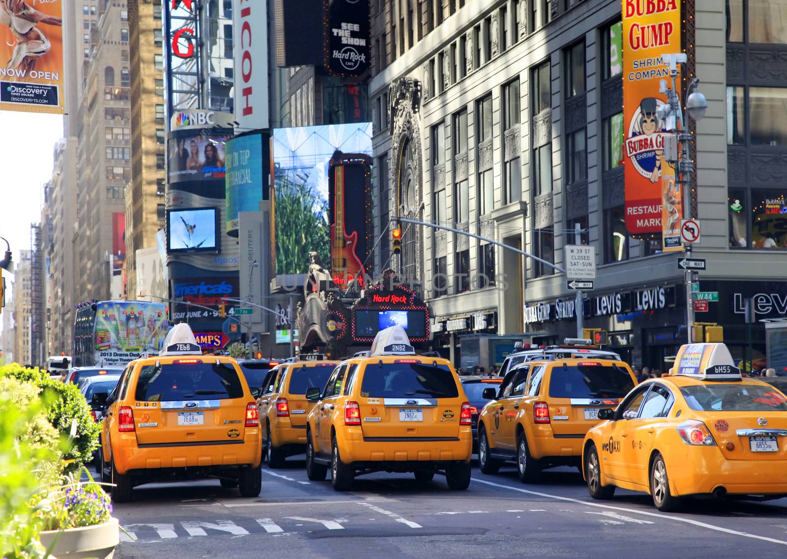 New York, NY, USA - May 17, 2013: Times Square, featured with Broadway Theaters and huge number of LED signs, is a symbol of New York City and the United States, May 17, 2013 in Manhattan, New York City