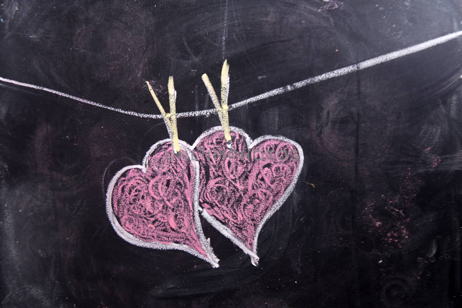 Done graphical representation with chalk on blackboard symbol of love, the heart