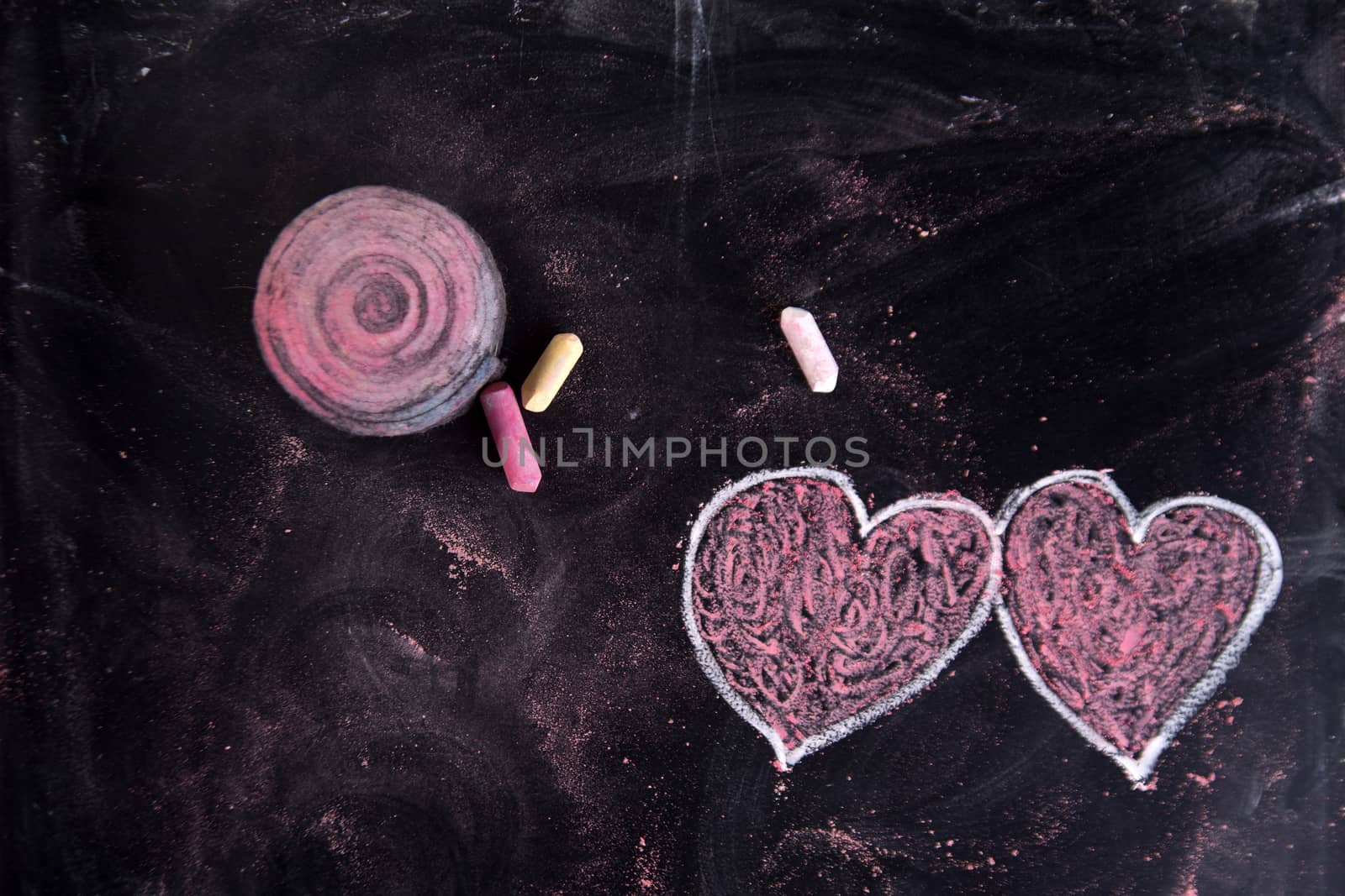 Done graphical representation with chalk on blackboard symbol of love, the heart