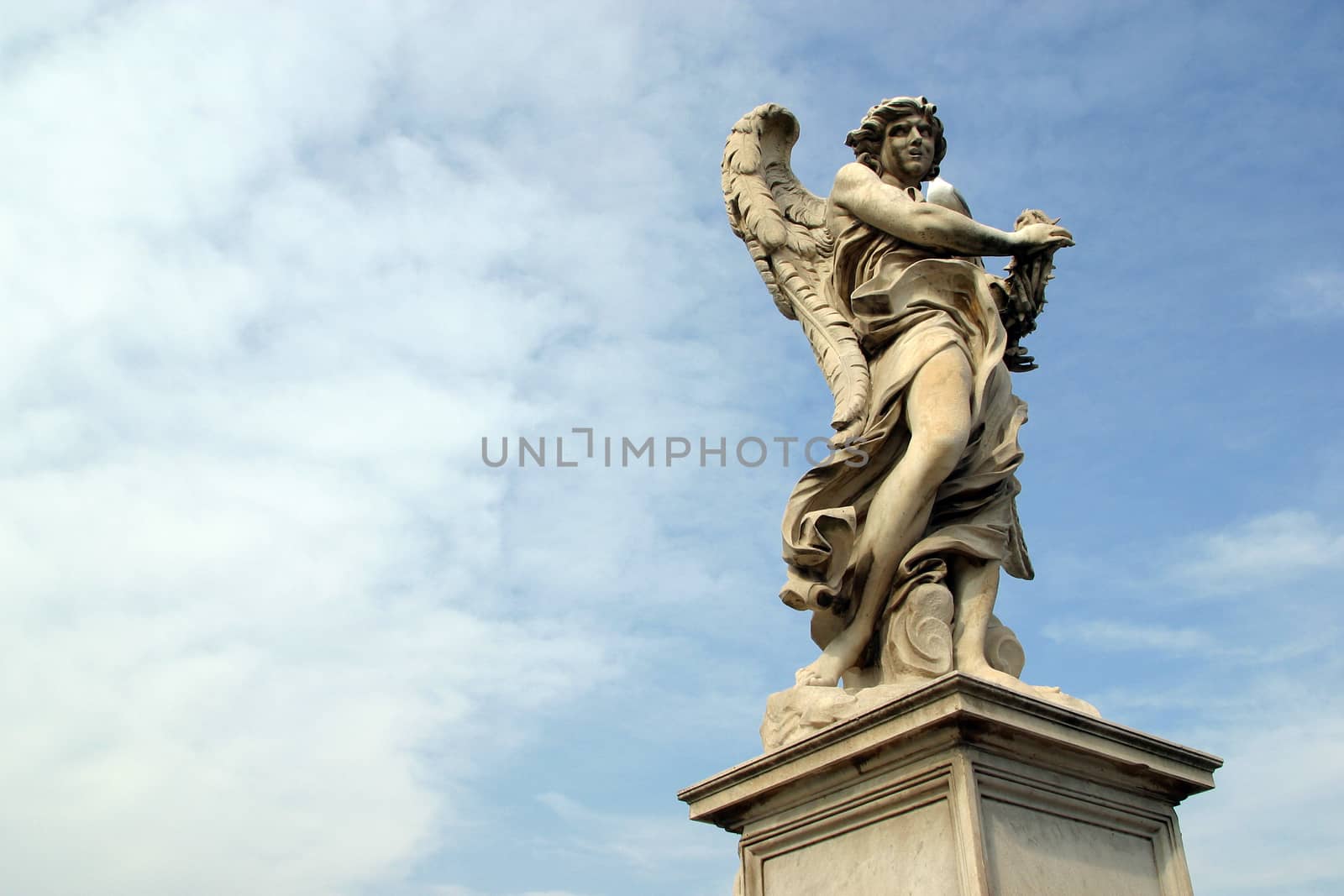 Bernini's angel along the Holy Angel bridge near the Hadrian Mausoleum in Rome, Italy