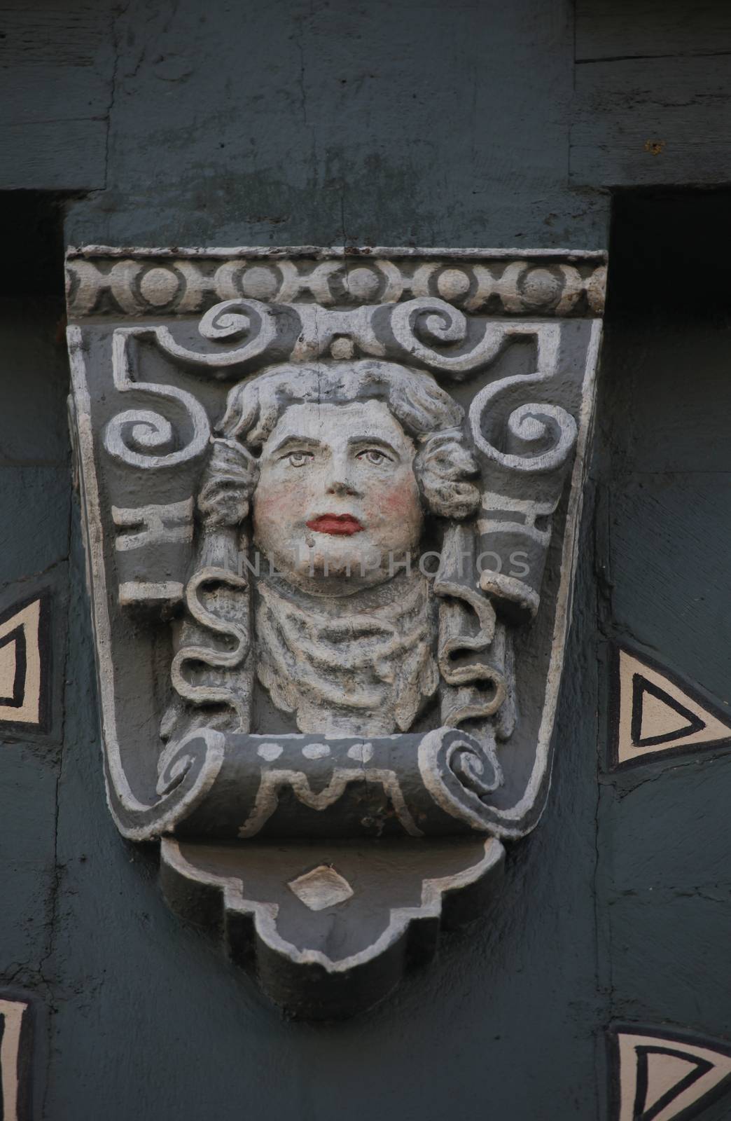 Detail of decorated facade with adages of an old half timbered house in old town of Miltenberg, Bavaria, Germany by atlas