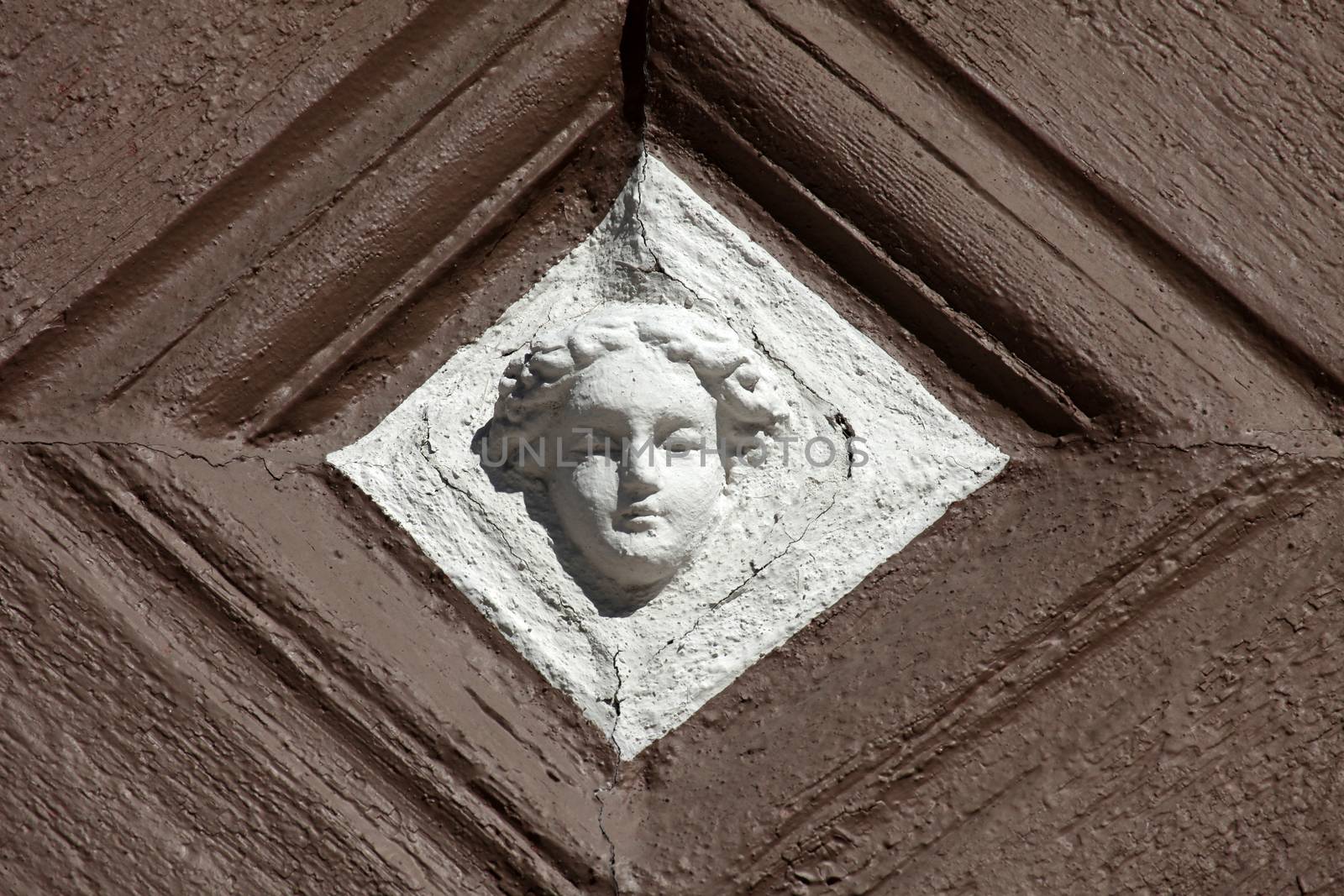 Detail of decorated facade with adages of an old half timbered house in old town of Miltenberg, Bavaria, Germany