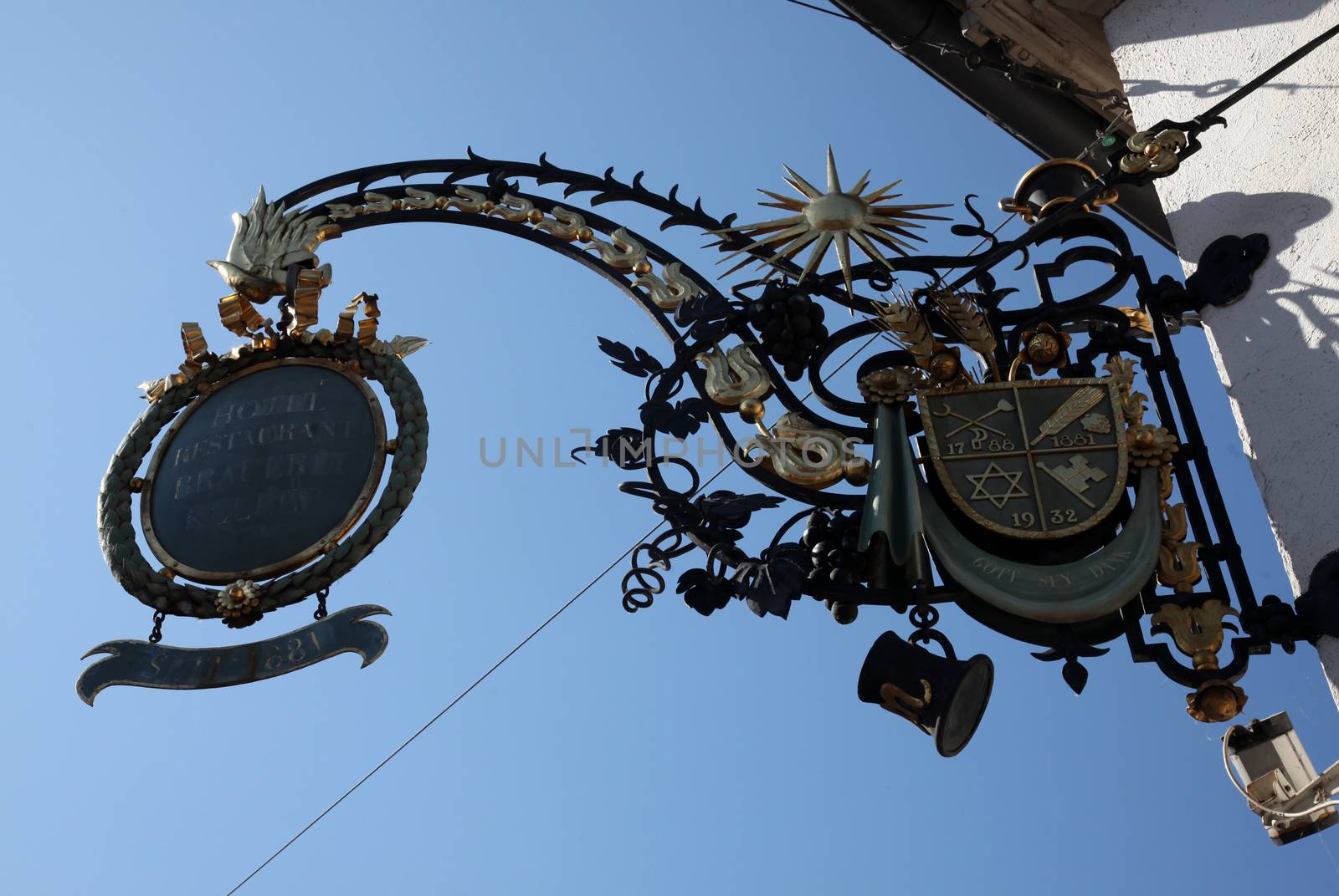 Old sign for an restaurant in the old town of Miltenberg, Germany by atlas