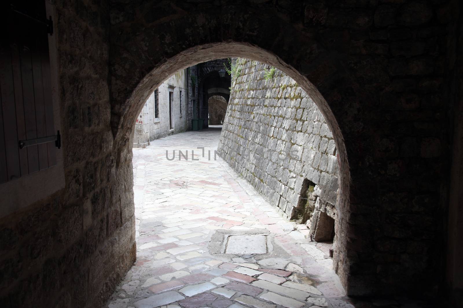 Ancient arch pathway on a Kotor old town in Montenegro