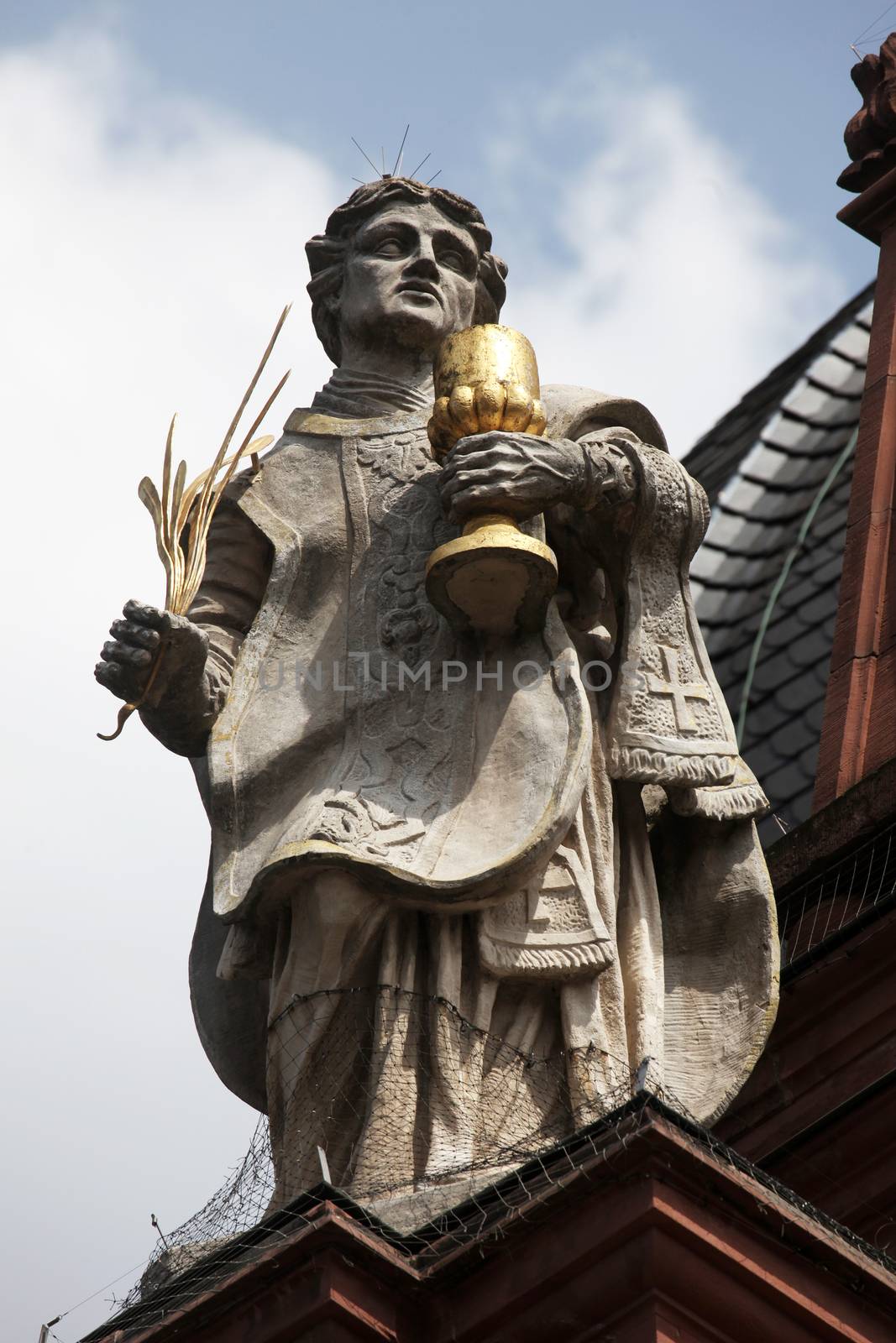 St. Totnan on the Facade of Neumunster Collegiate Church in Wurzburg