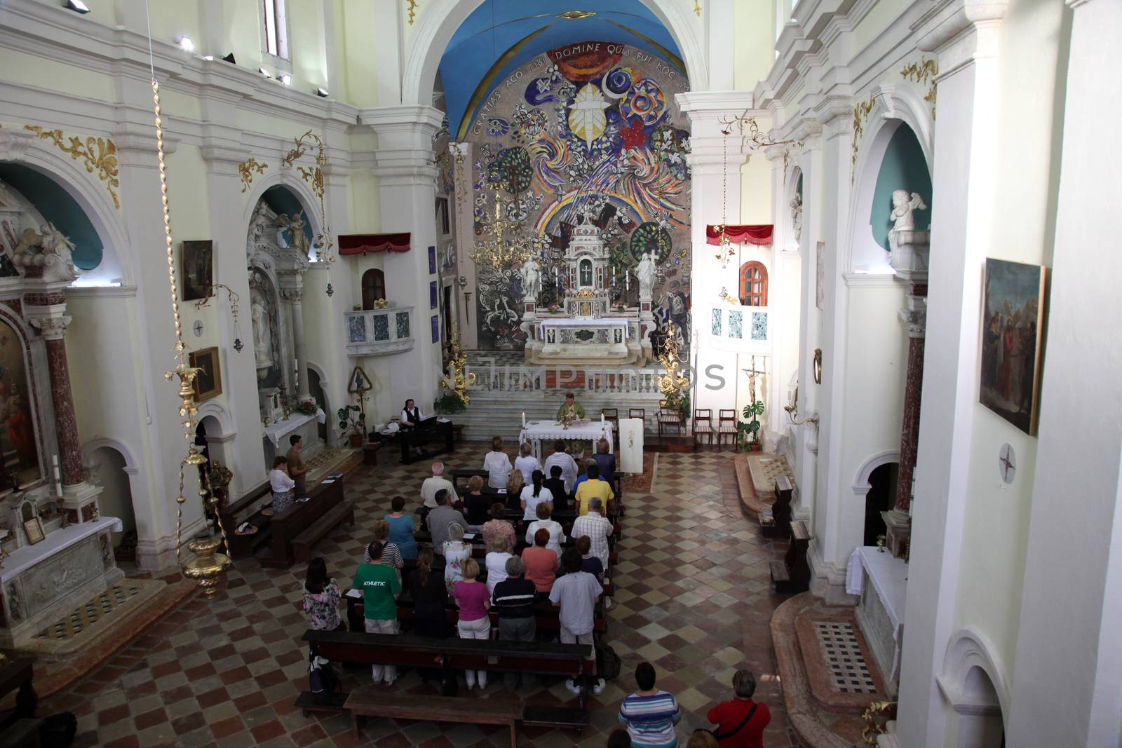 Mass for pilgrims in the Catholic Church Saint Eustache in Dobrota, Montenegro by atlas