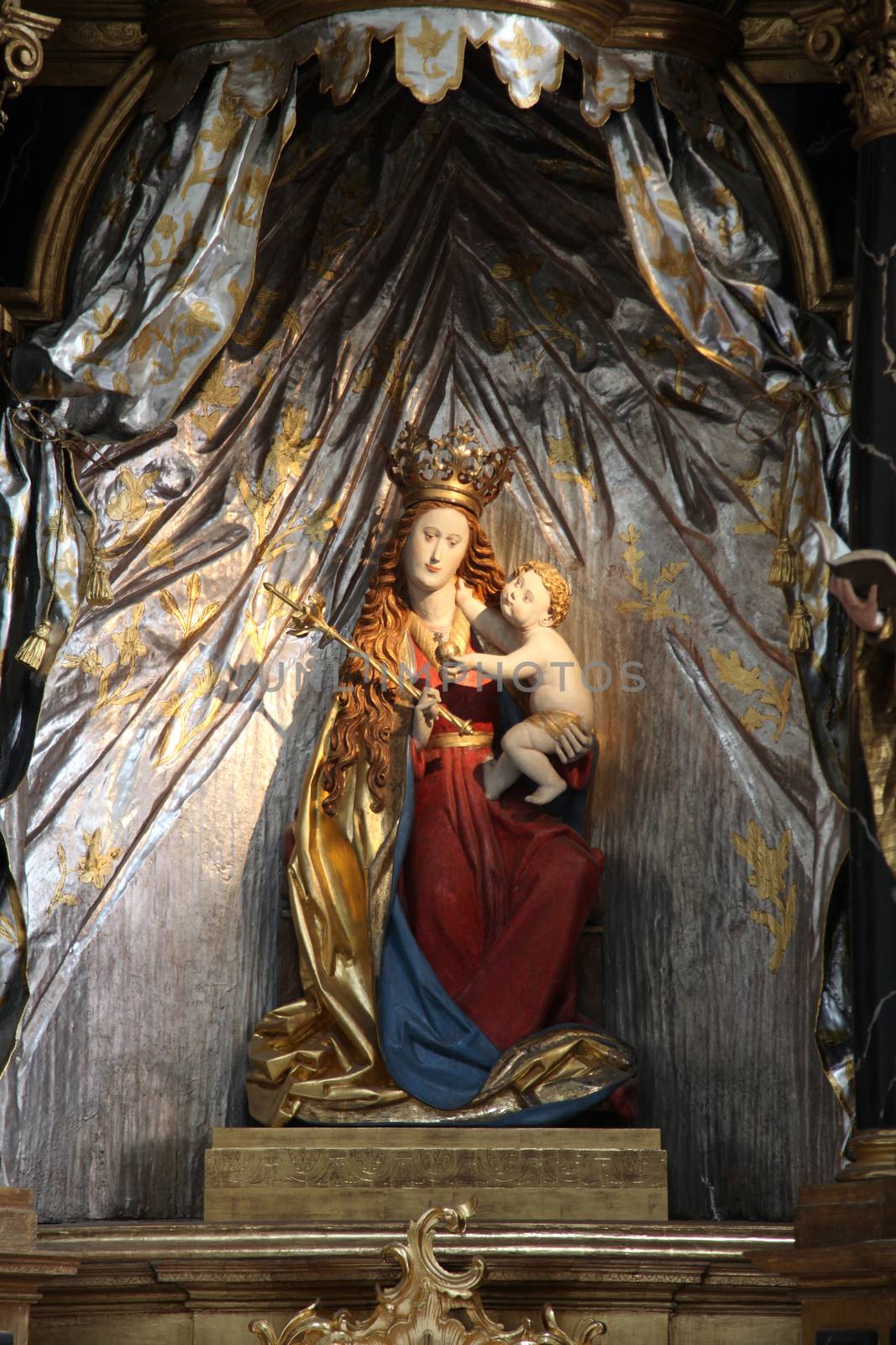 Madonna with child Jesus, altar in the Neumunster Collegiate Church in Wurzburg, Germany