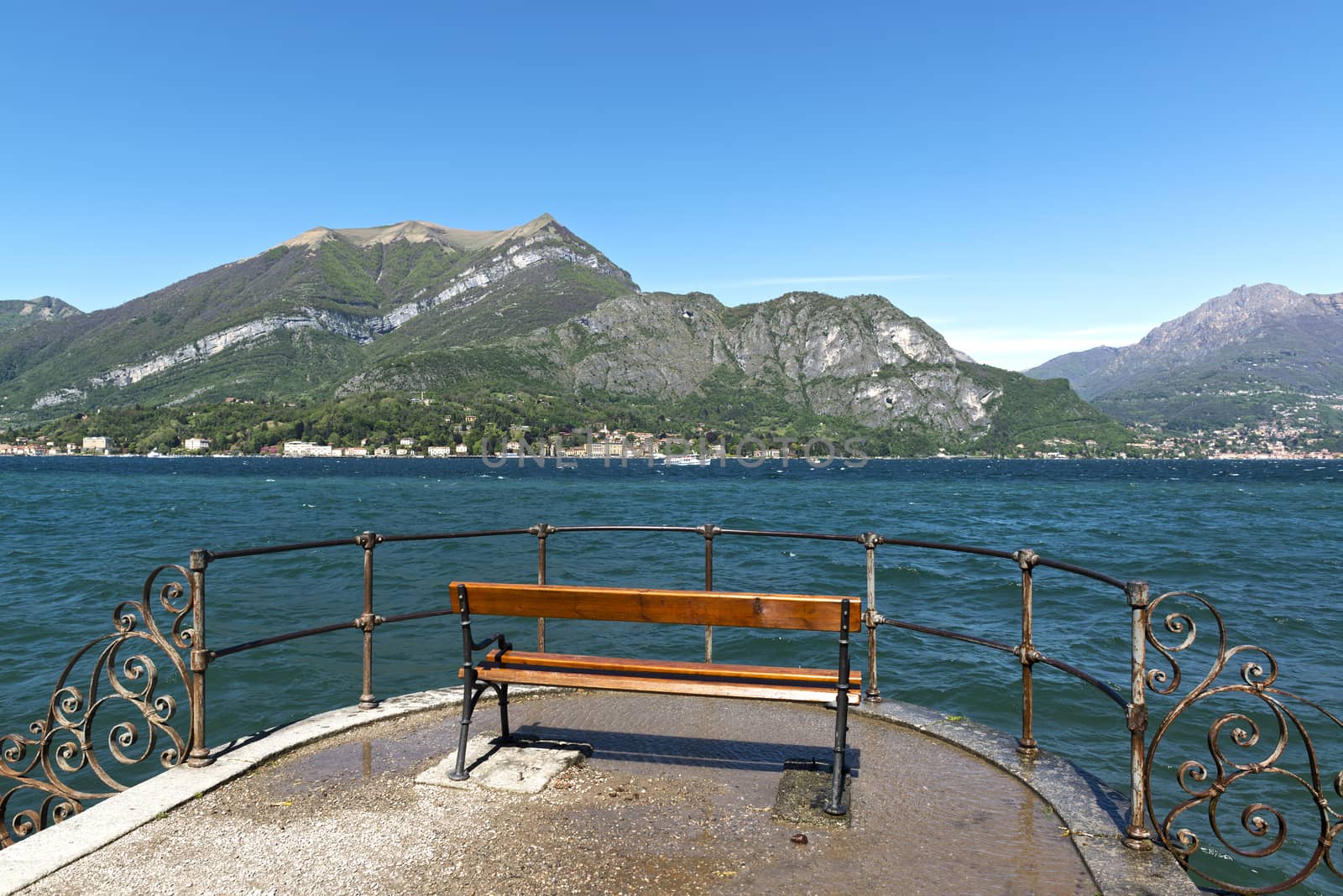 bench with beautiful views of Lake Como in a quiet and sunny spring morning, Bellagio