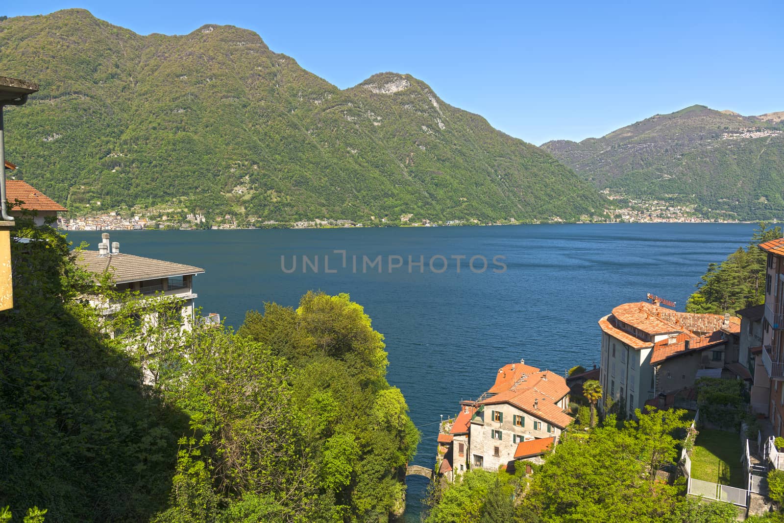 Landscape on the Como Lake in a clear morning of spring season