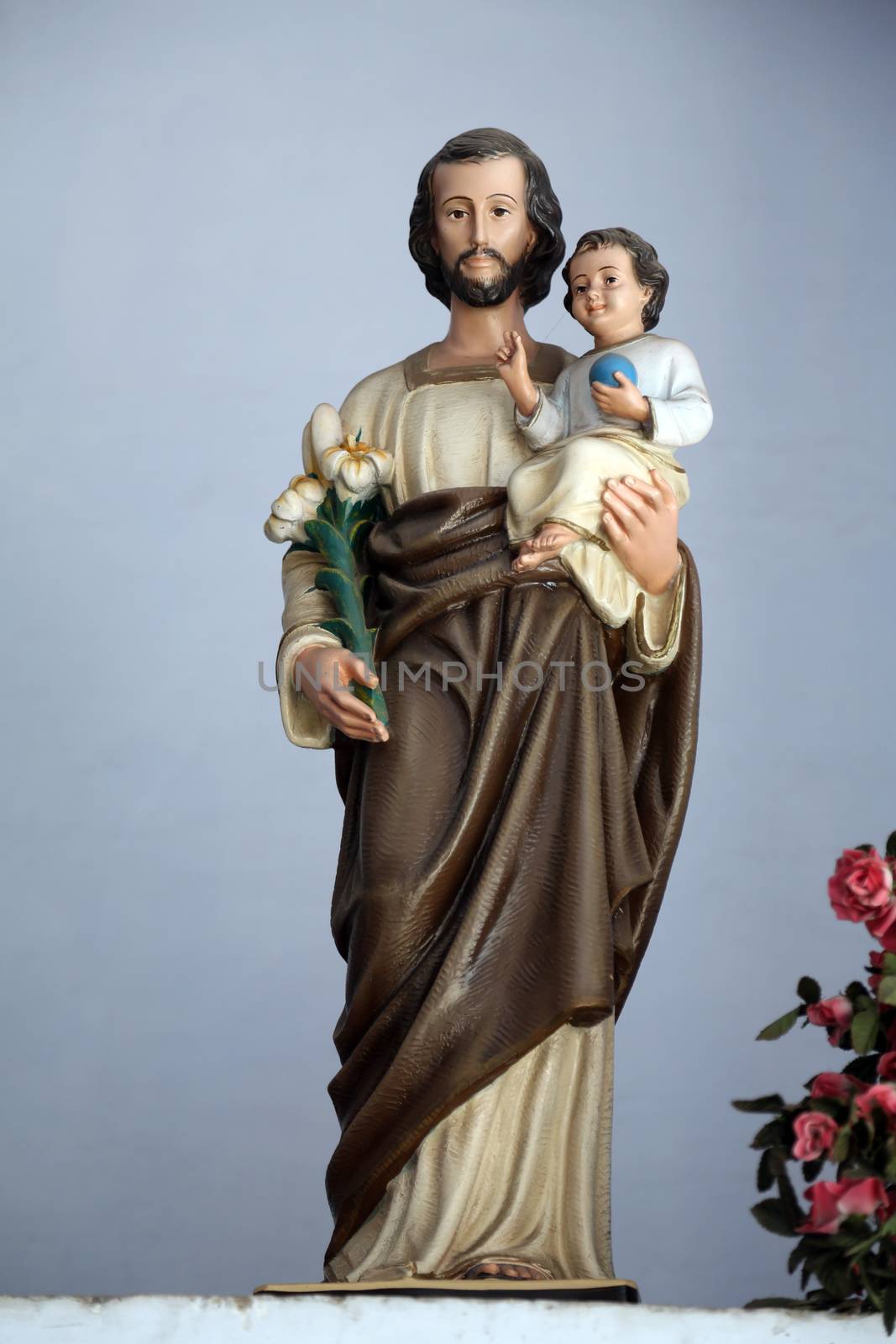 Saint Joseph holding baby Jesus by atlas