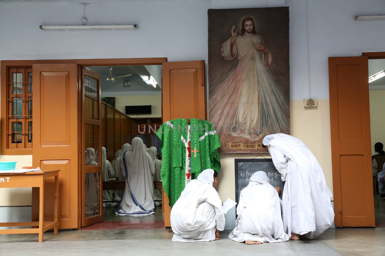 Sister of Missionaries of Charity preparing for prayer in Motherhouse, Kolkata, India